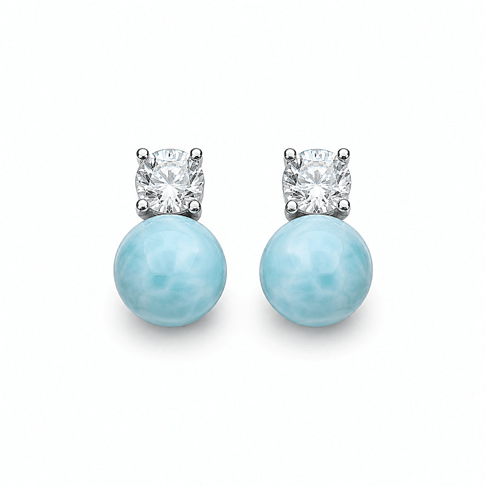 Discover the Mermaid's Tear Larimar Stud Earrings at The Luxe Maison, featuring luminous natural larimar stones paired with sparkling cubic zirconia. Inspired by the turquoise hues of the Caribbean Sea, these elegant earrings bring a refreshing touch of coastal beauty to everyday outfits and special occasions.