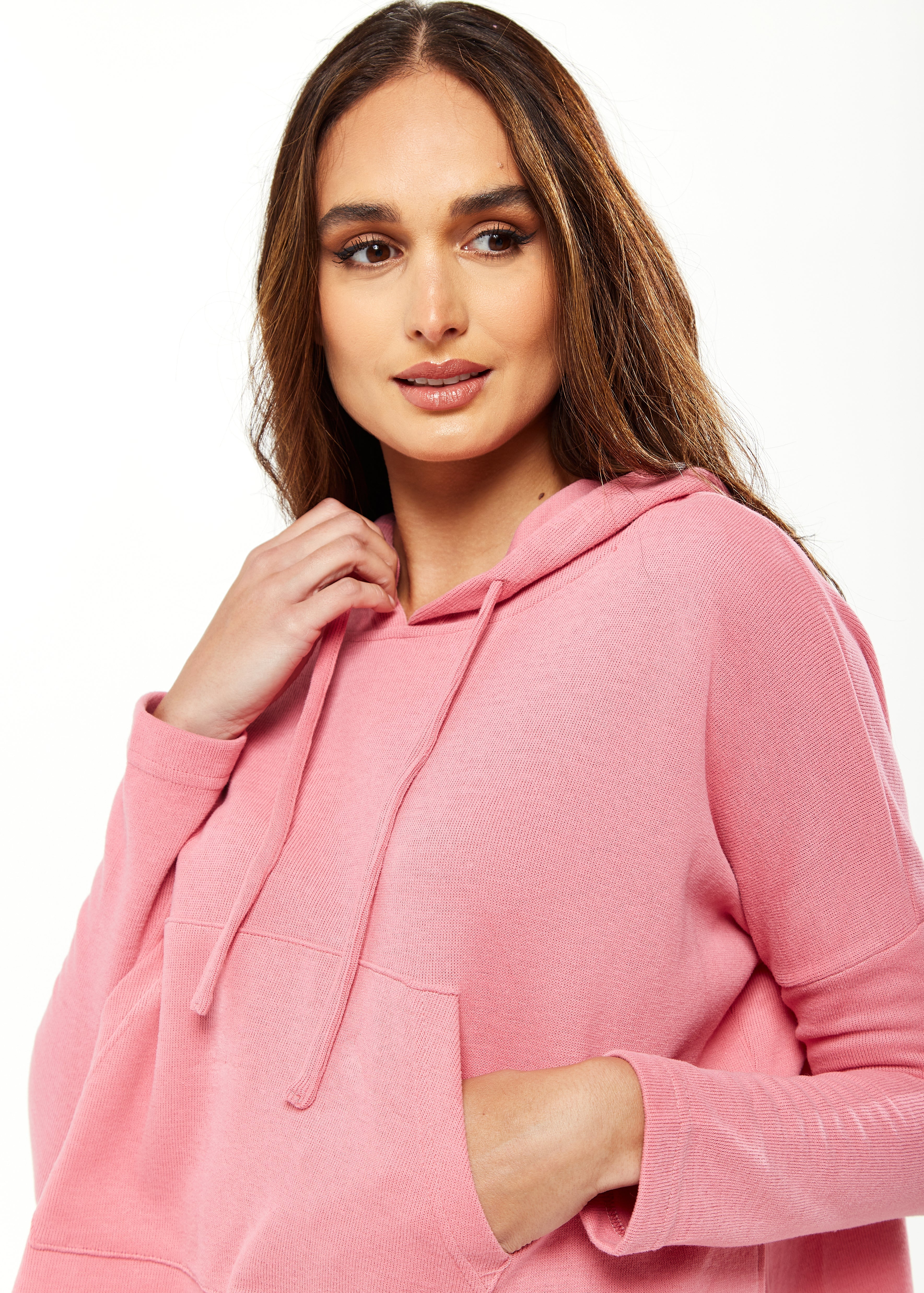 Women's Oversized Hooded Sweatshirt with Front Pocket in Pink - Stylish, Comfortable, with Side Slits and Adjustable Hood