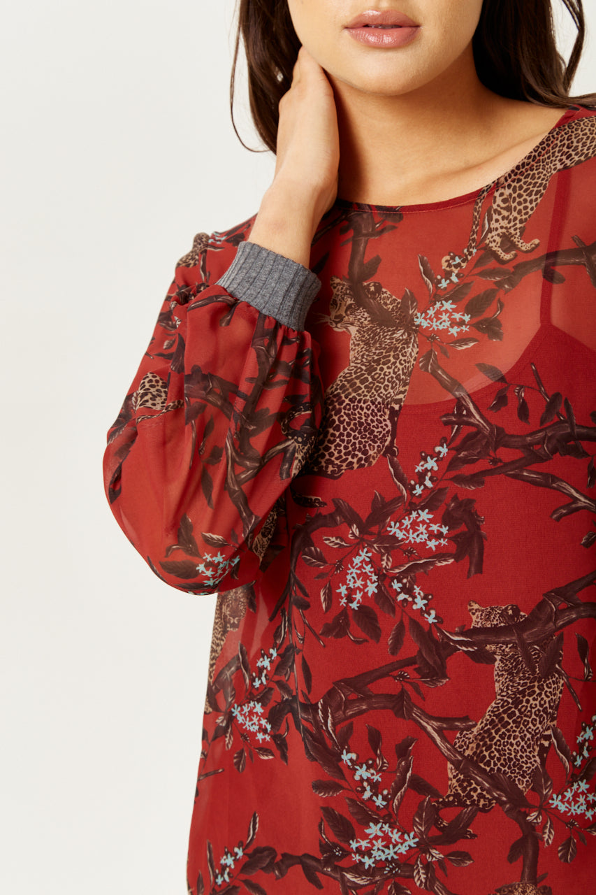Find trendy luxury dresses online including the Women's Long Sleeve Red Leopard Top. Shop Now!