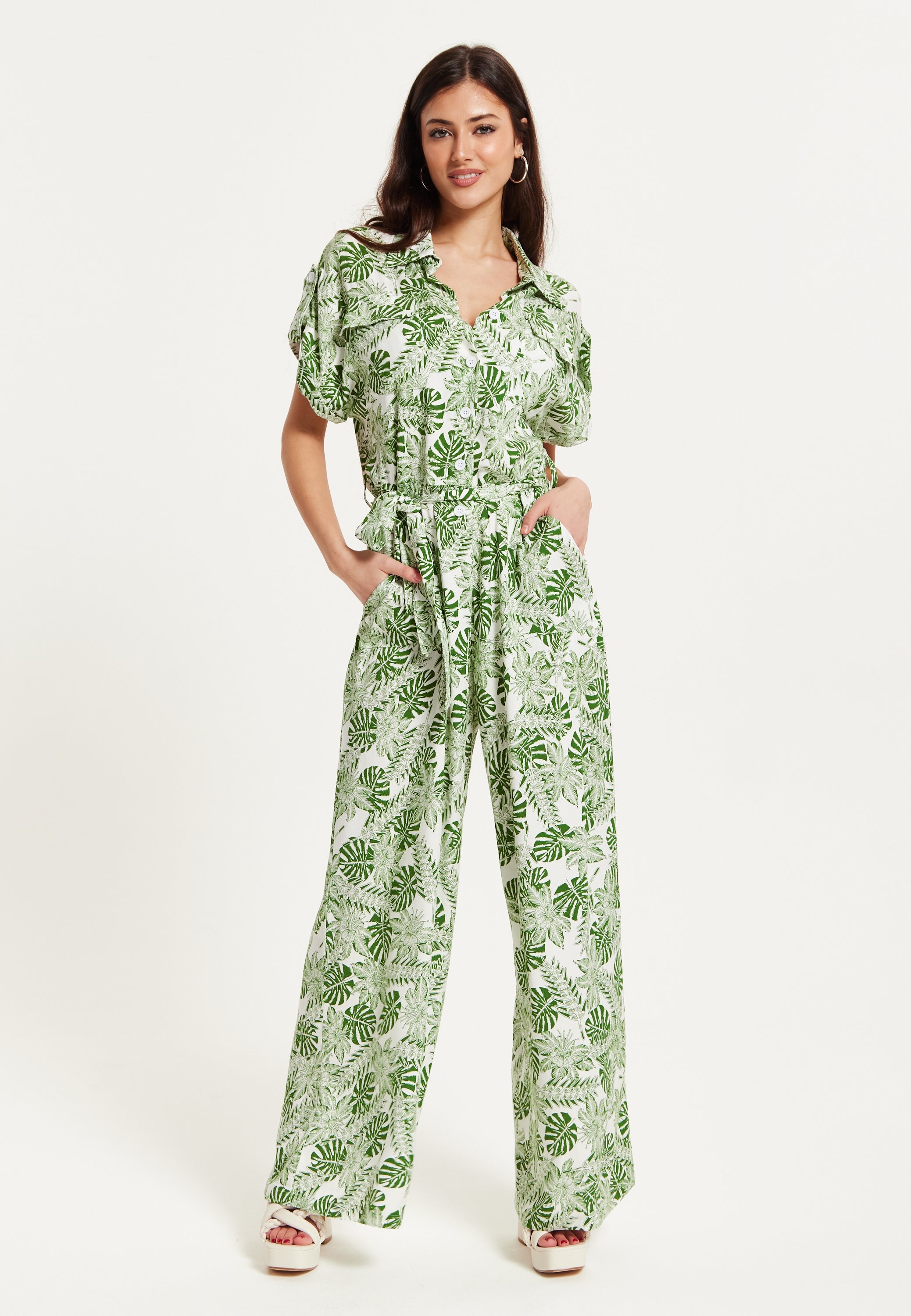 Women's Green Leaf Printed Loose Fit Jumpsuit with Tie Waist and Pocket Details - Liquorish