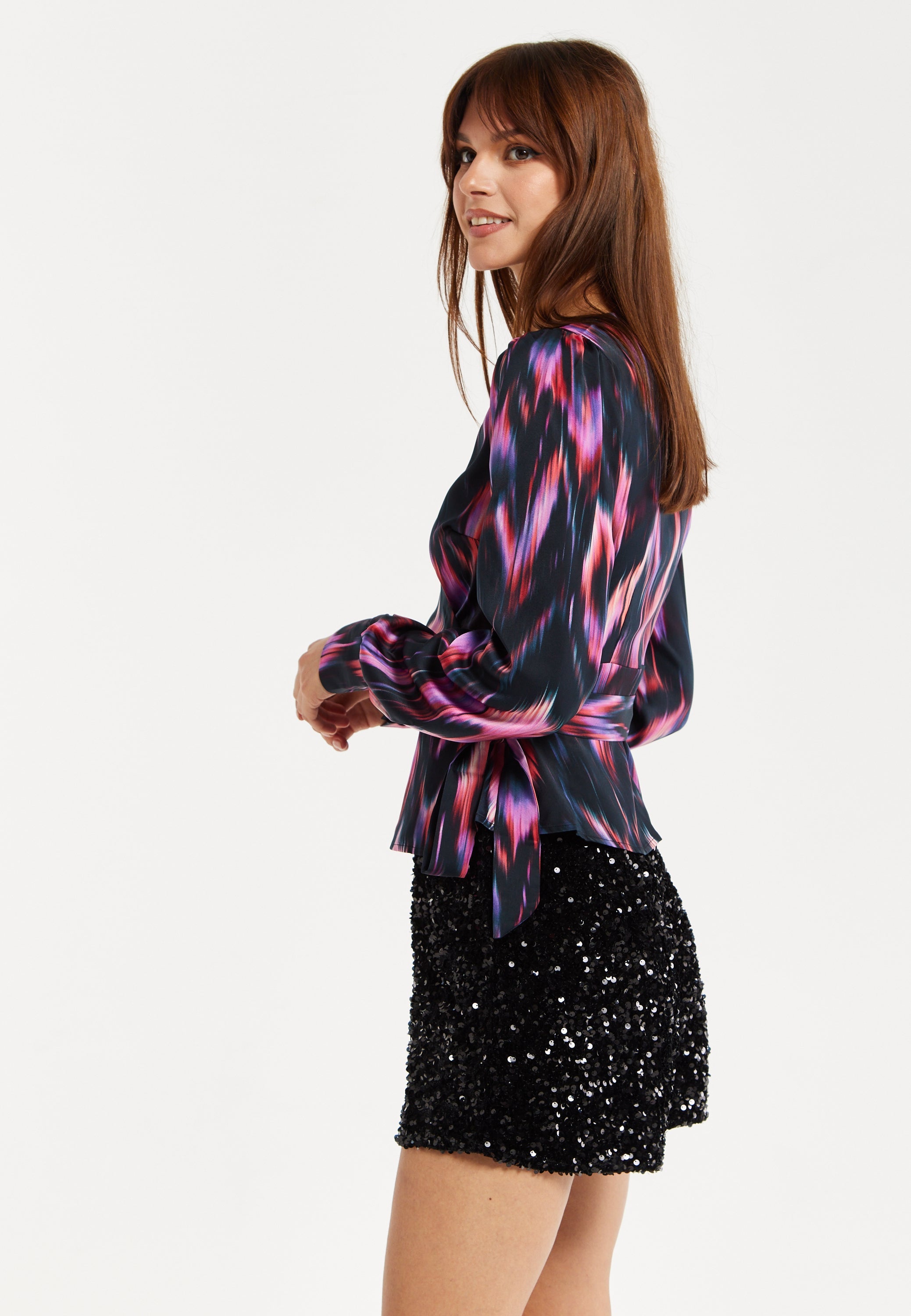 Women's Abstract Ikat Top in Black with Vibrant Feather Print, Long Balloon Sleeves, Button-Up High Neck Collar.