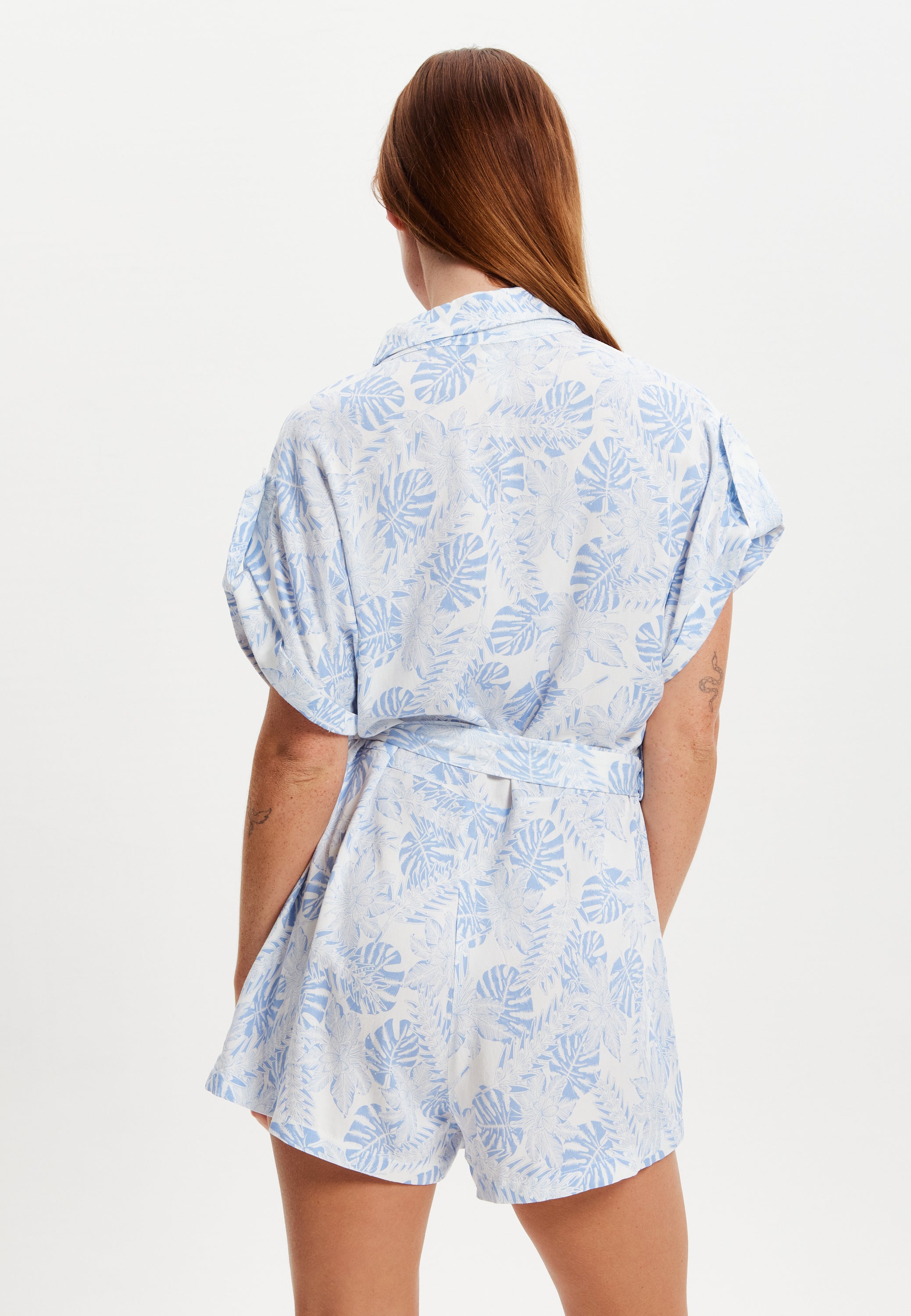 Women's Blue Leaf Printed Playsuit with Button Down, Short Sleeve, Front & Side Pockets, Loose Fit, Casual Style.
