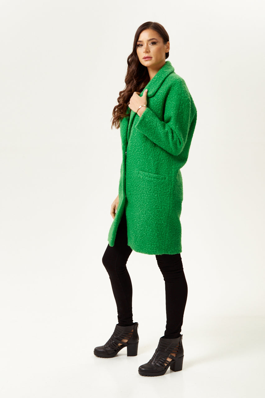 Discover online dress stores featuring a women’s fluffy green bouclé coat for standout winter style. Shop Now!