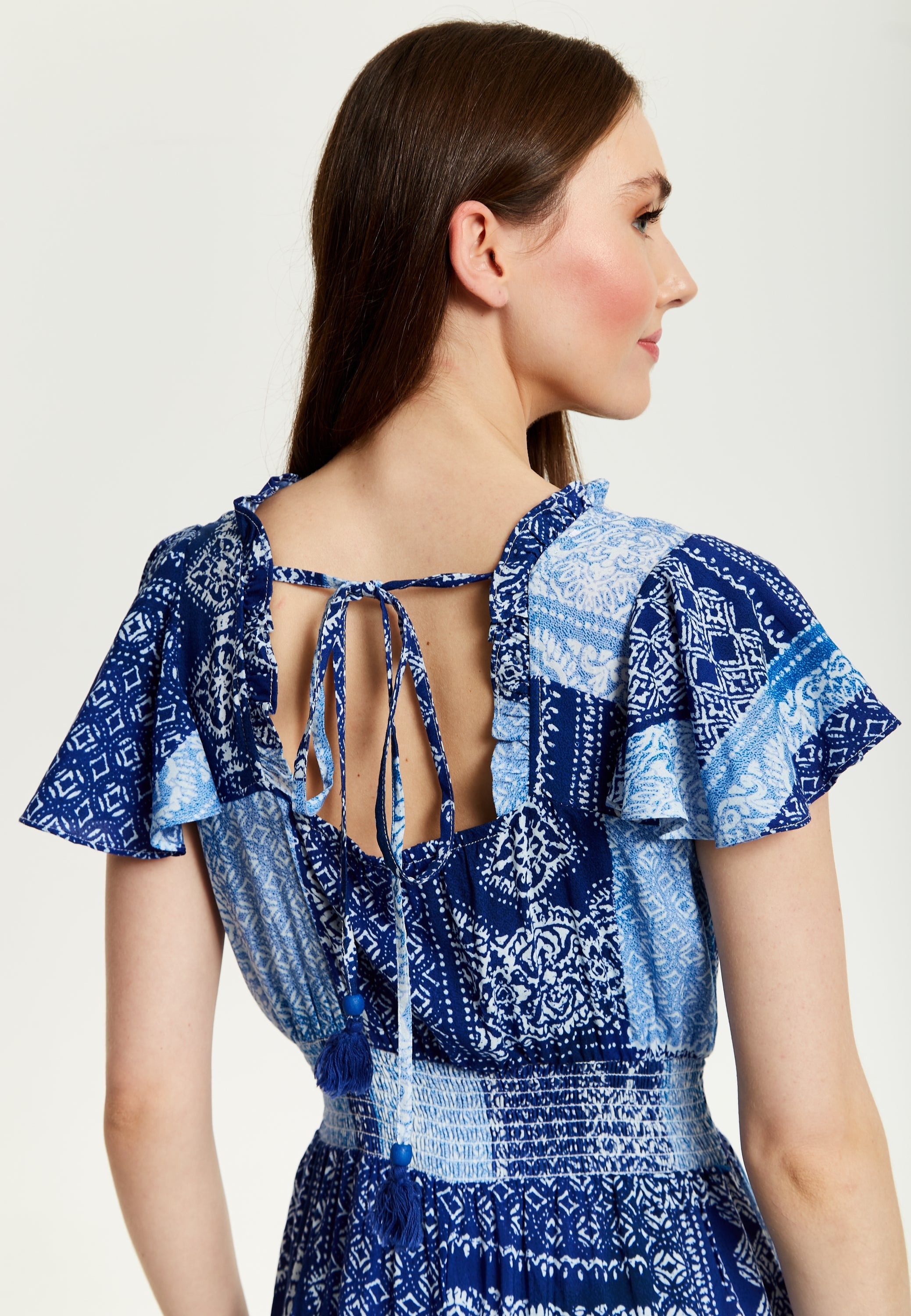 Women's Maxi Dress in Blue Tile Print with Short Sleeves and Open Back Tie Detail - Liquorish