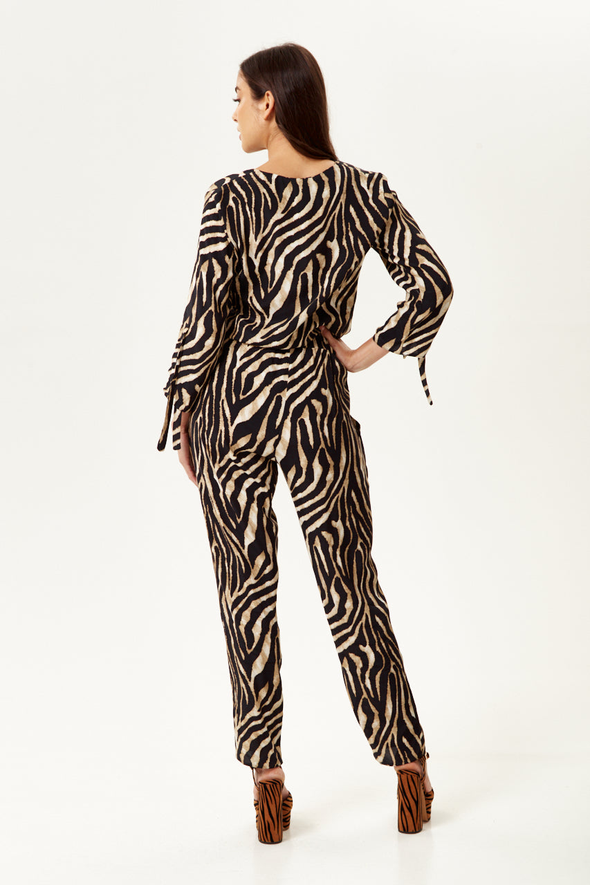 Shop designer dress styles with the bold Women's Zebra Print Jumpsuit for a chic look. Shop Now!