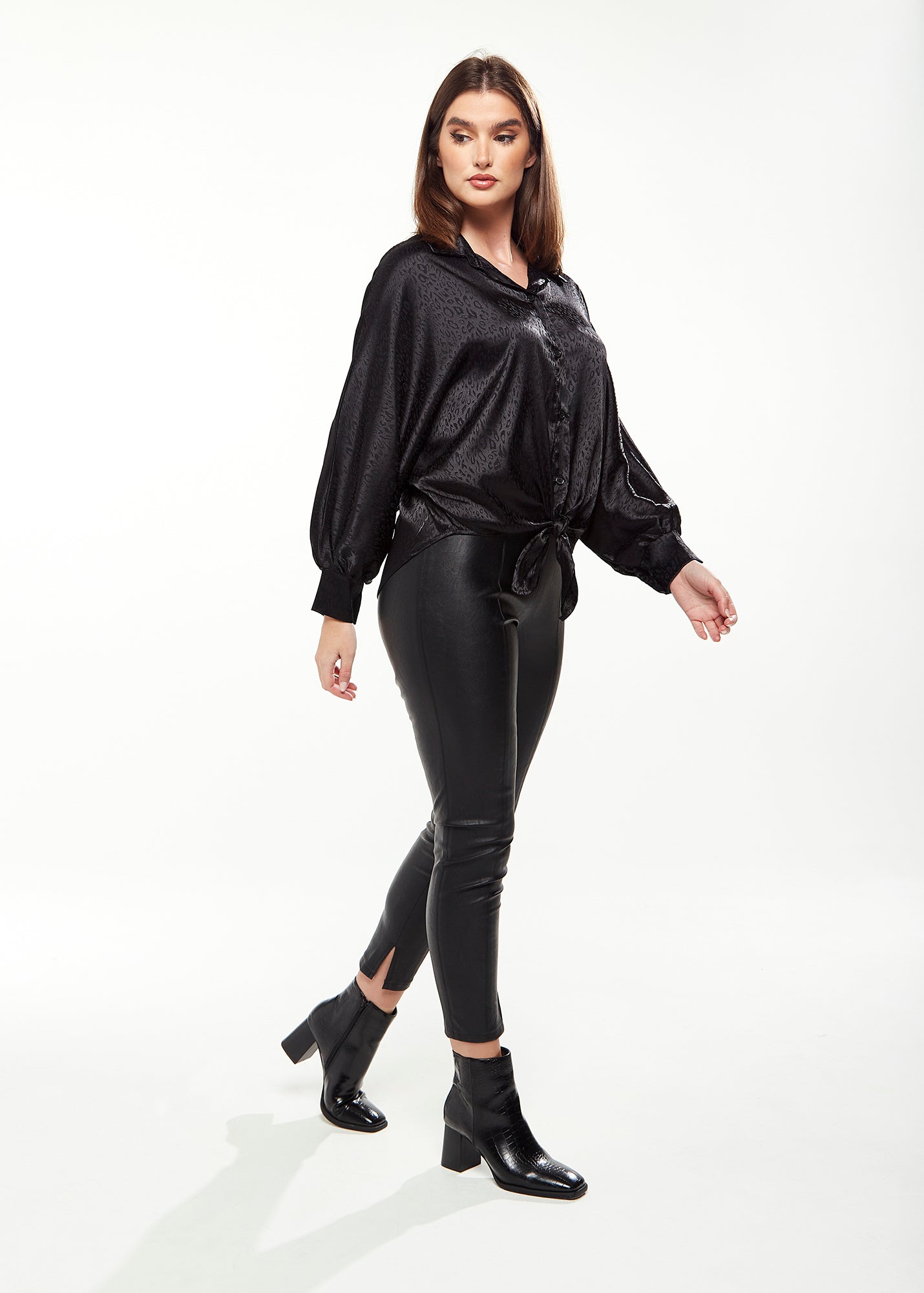 Women's Divine Grace Leopard Jacquard Blouse with Front Waist Tie in Black, Long Sleeves, Button Front, and Collar.