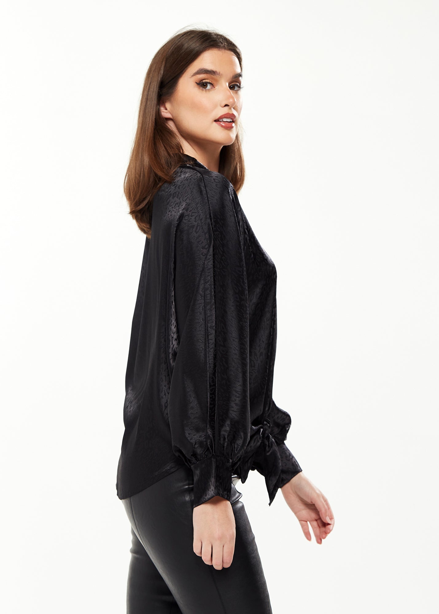 Women's Divine Grace Leopard Jacquard Blouse with Front Waist Tie in Black, Long Sleeves, Button Front, and Collar.