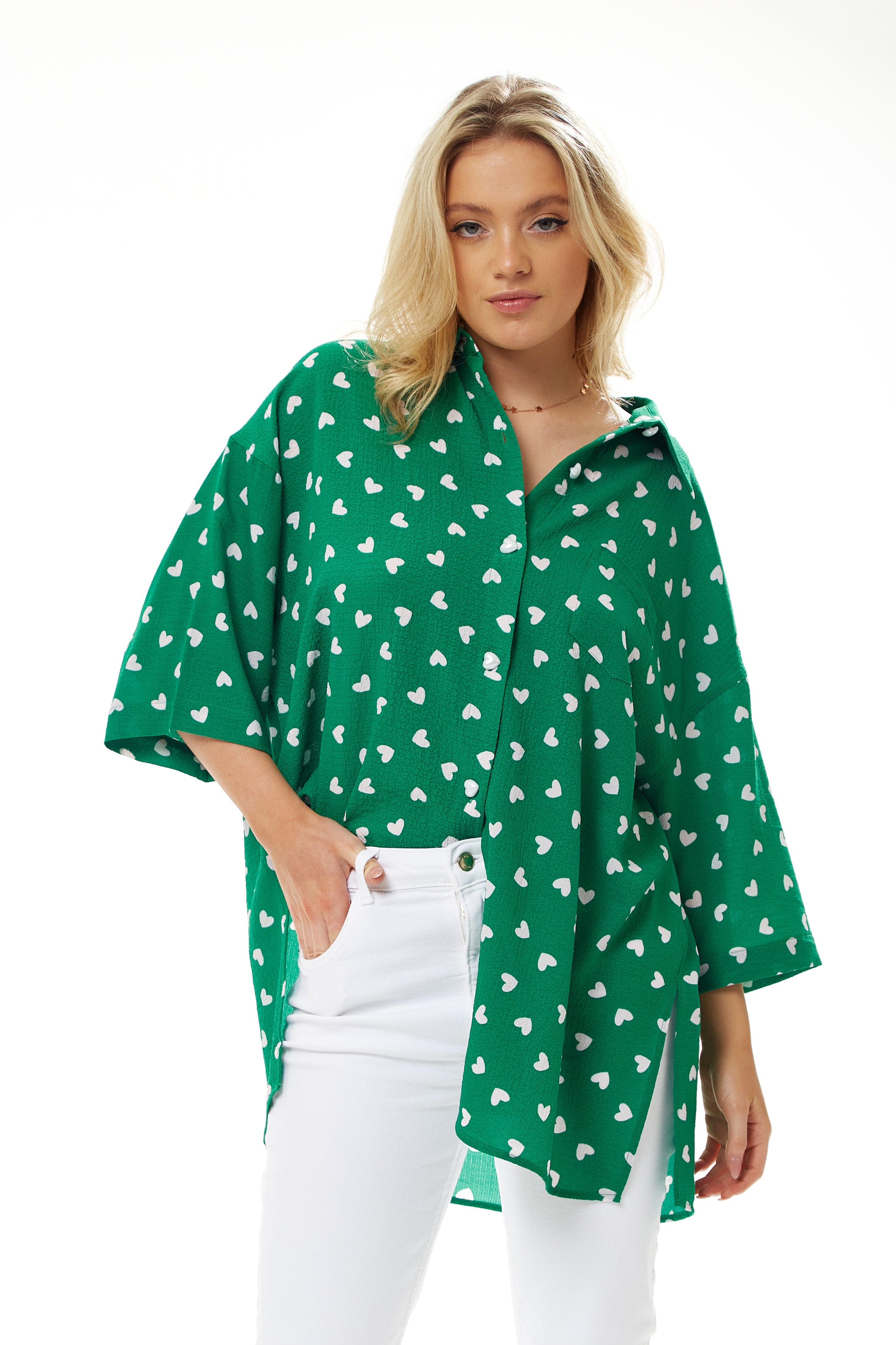 Women's White Heart Print Shirt in Green - Short sleeves, oversized fit, heart-shaped buttons, button-up front, collar.