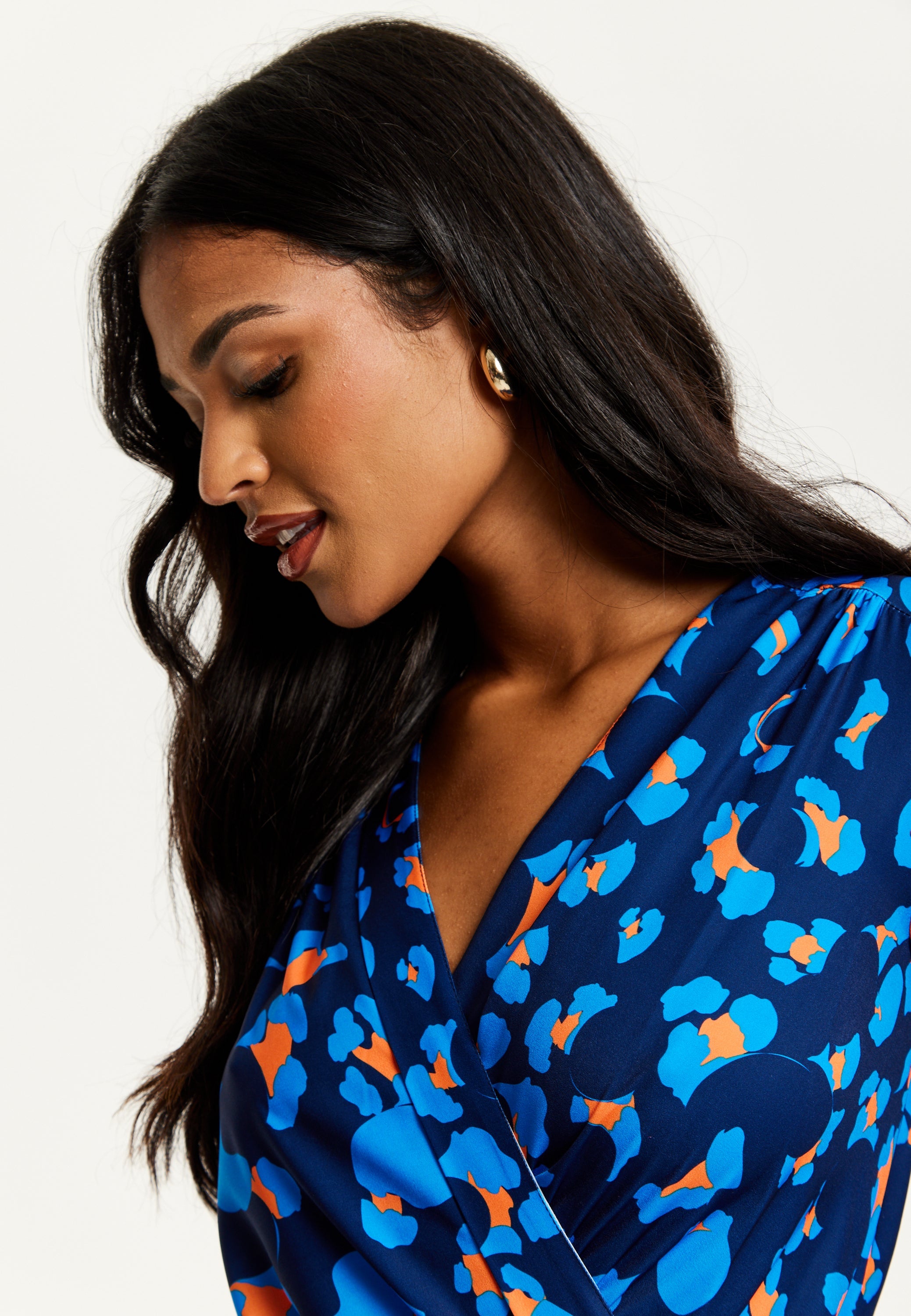 Women's Midi Wrap Dress in Blue with Long Sleeves - Elegant Abstract Print Design by Liquorish