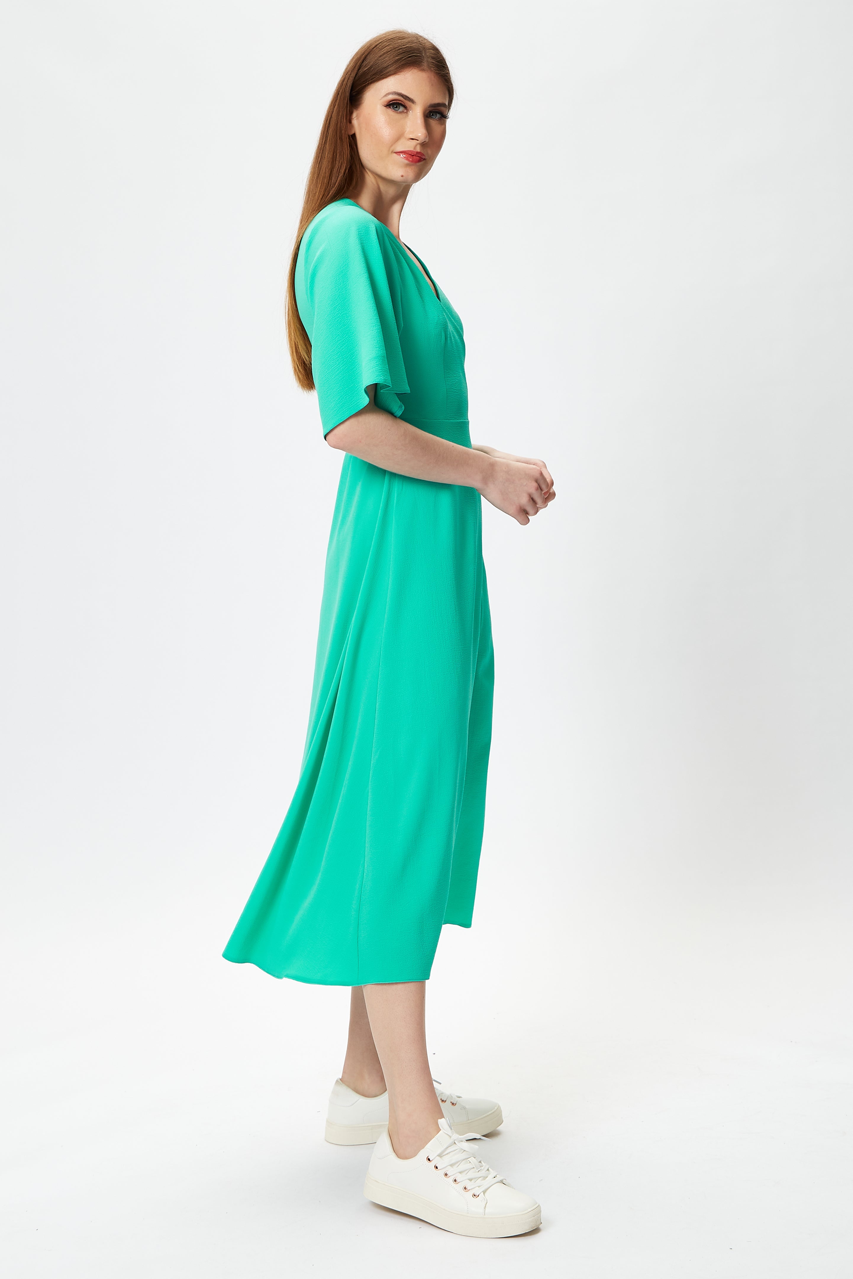 Elevate your look with luxury women's wear and the Women’s Midi Wrap Dress. Shop Now!
