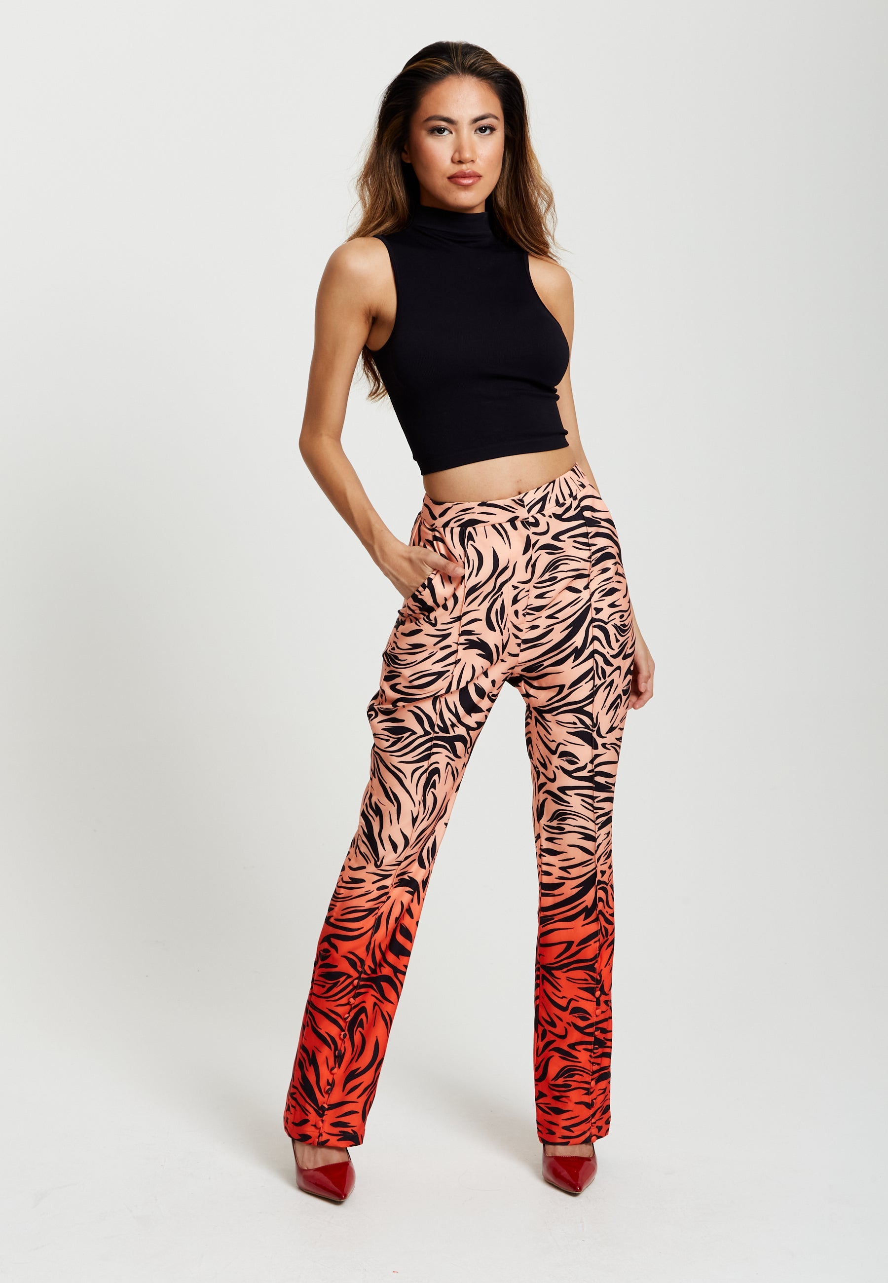 Women's Trousers in Orange and Nude Zebra Print with Slit Detail and Button Closure by Liquorish
