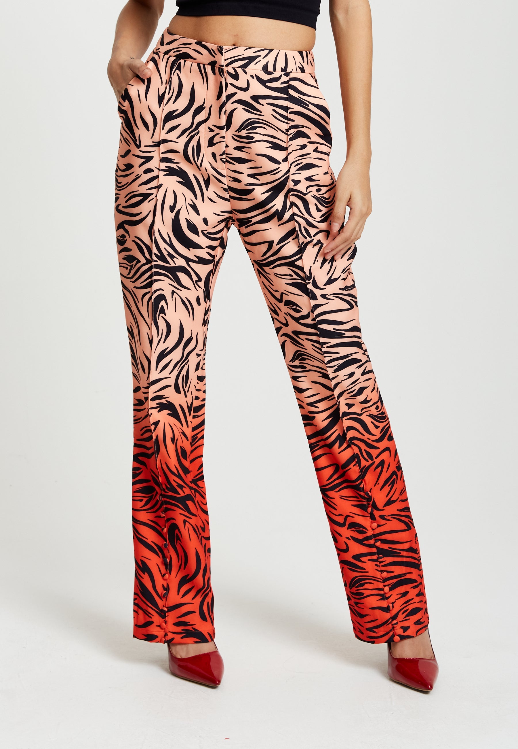 Women's Trousers in Orange and Nude Zebra Print with Slit Detail and Button Closure by Liquorish