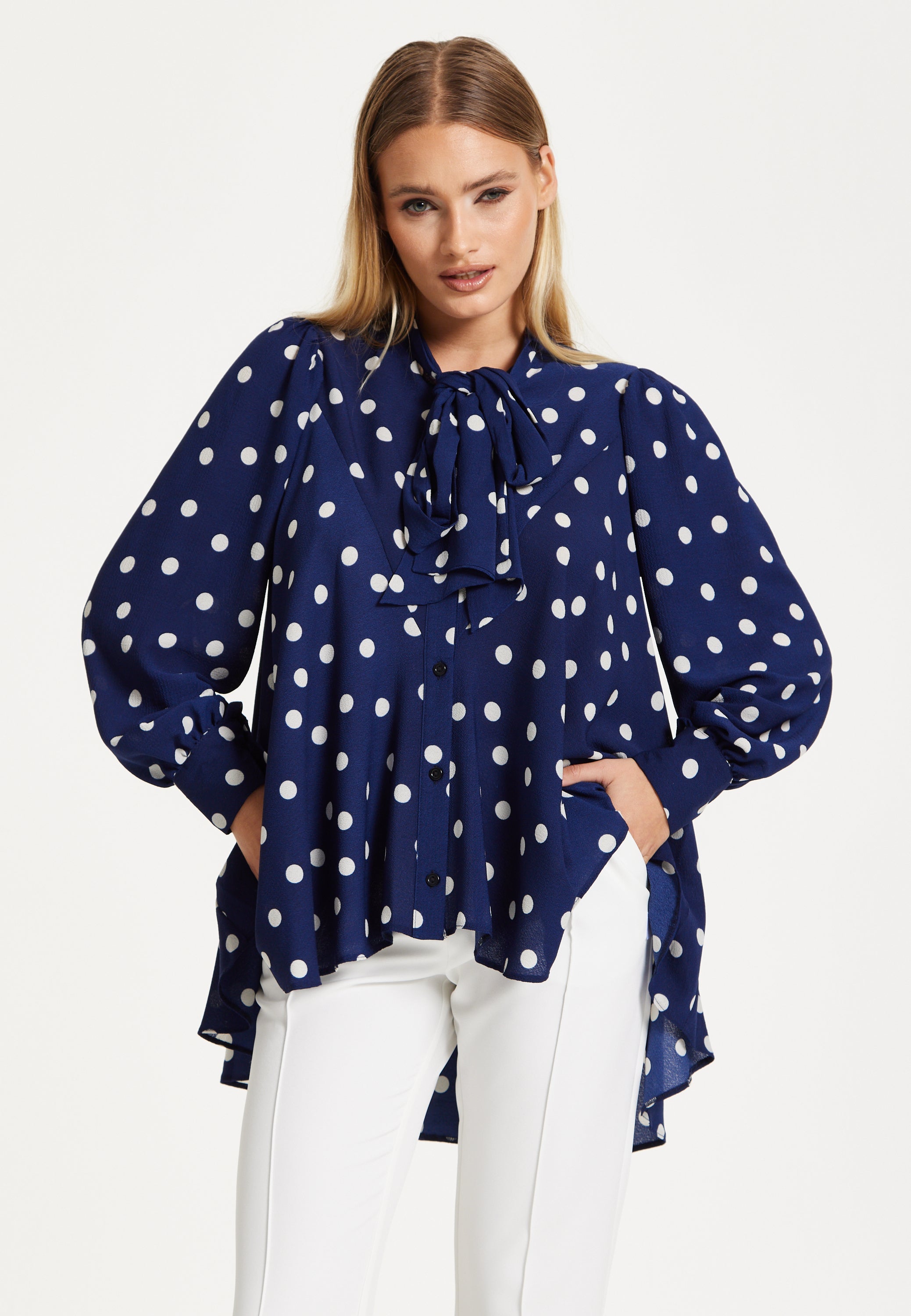 Navy Polka Dot Flared Hem Blouse