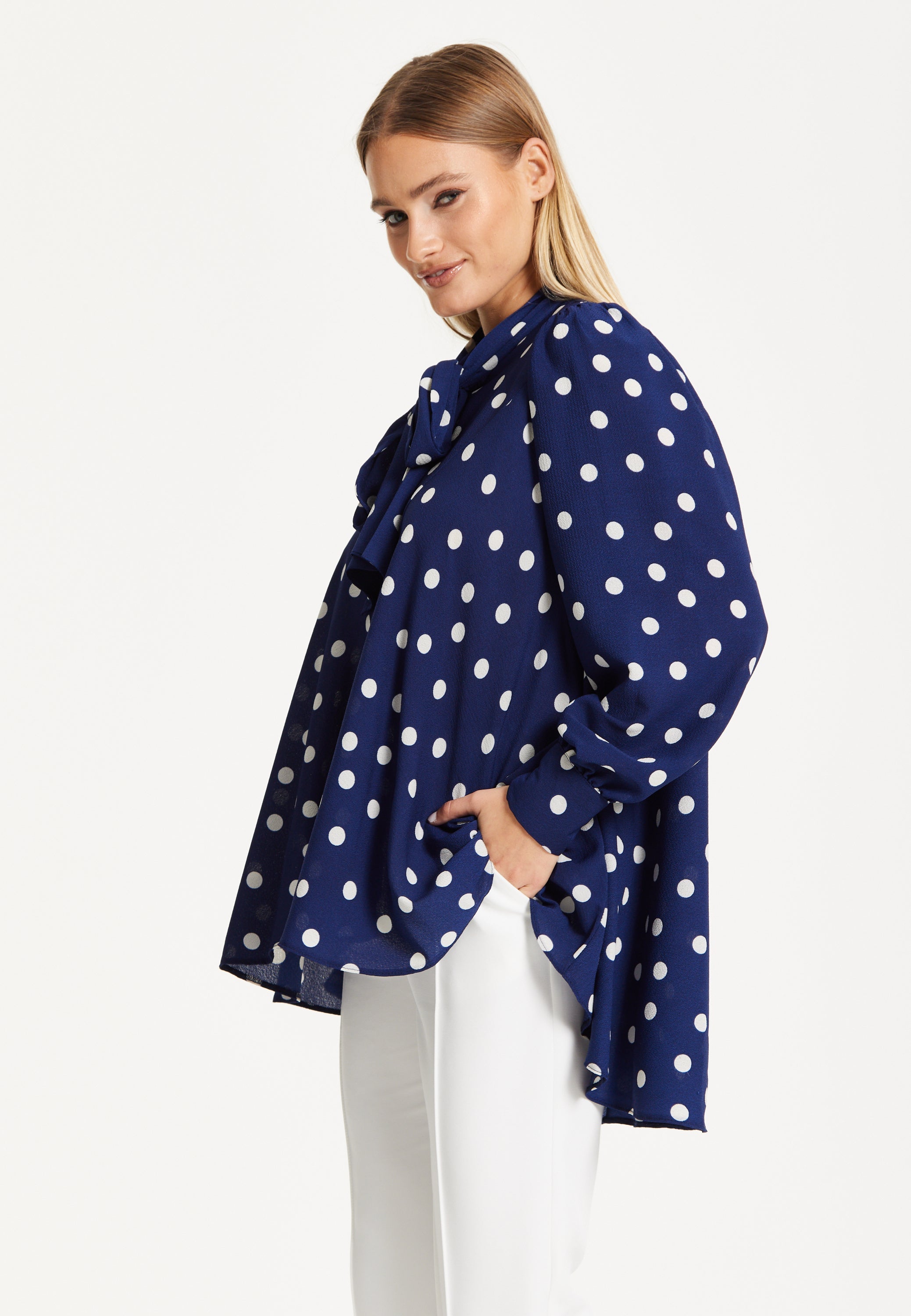 Navy Polka Dot Flared Hem Blouse