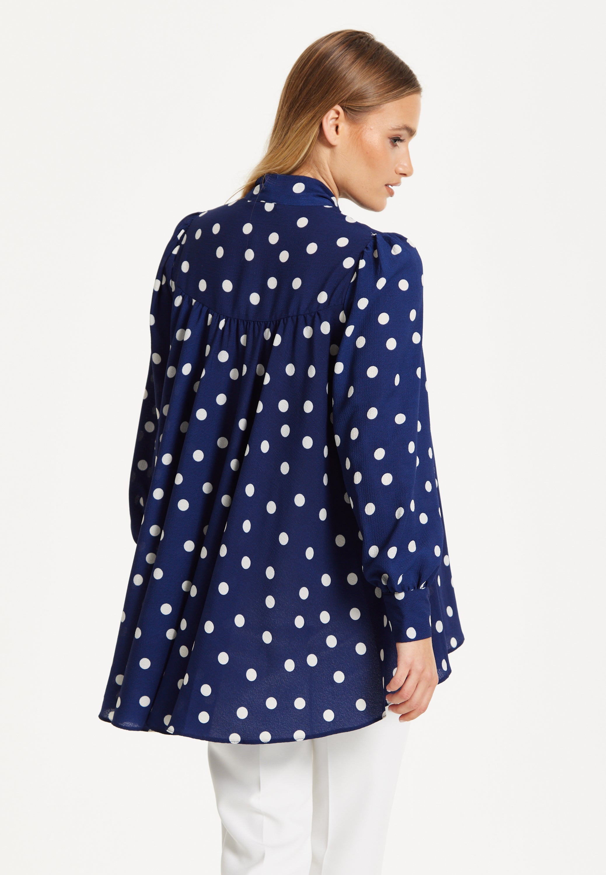 Navy Polka Dot Flared Hem Blouse