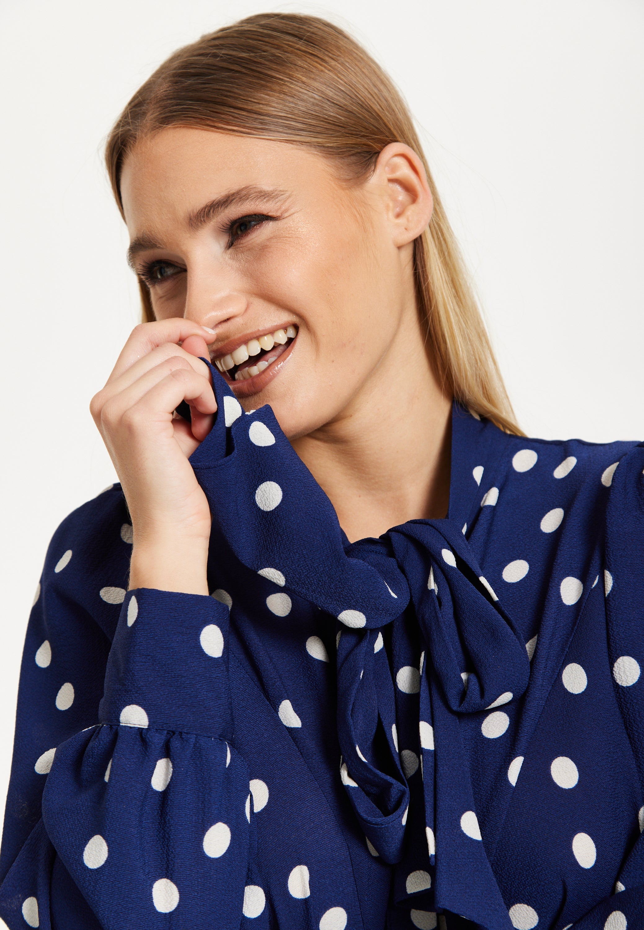 Navy Polka Dot Flared Hem Blouse