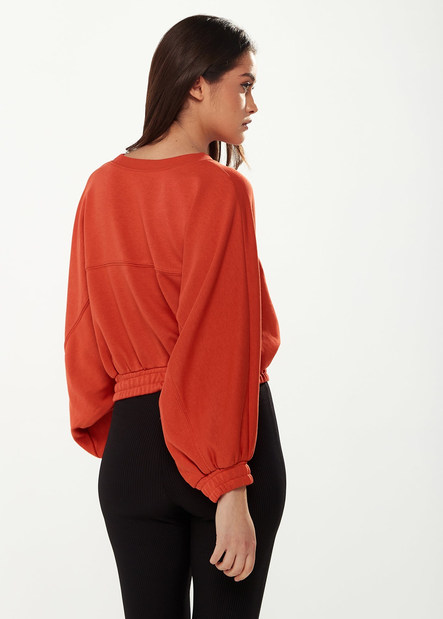 Women's Cropped Sweatshirt in Dark Orange with Voluminous Bat and Balloon Sleeves, Elastic Cuffs, and a Chic Design.