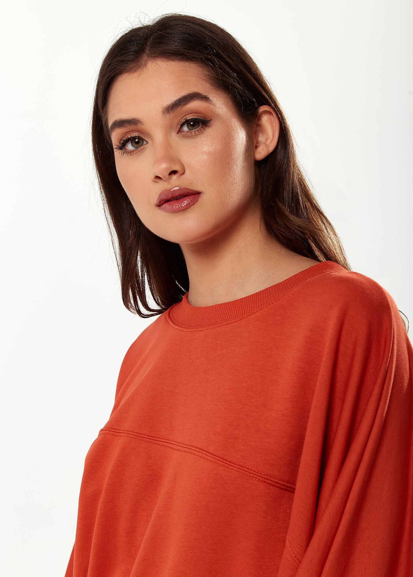 Women's Cropped Sweatshirt in Dark Orange with Voluminous Bat and Balloon Sleeves, Elastic Cuffs, and a Chic Design.