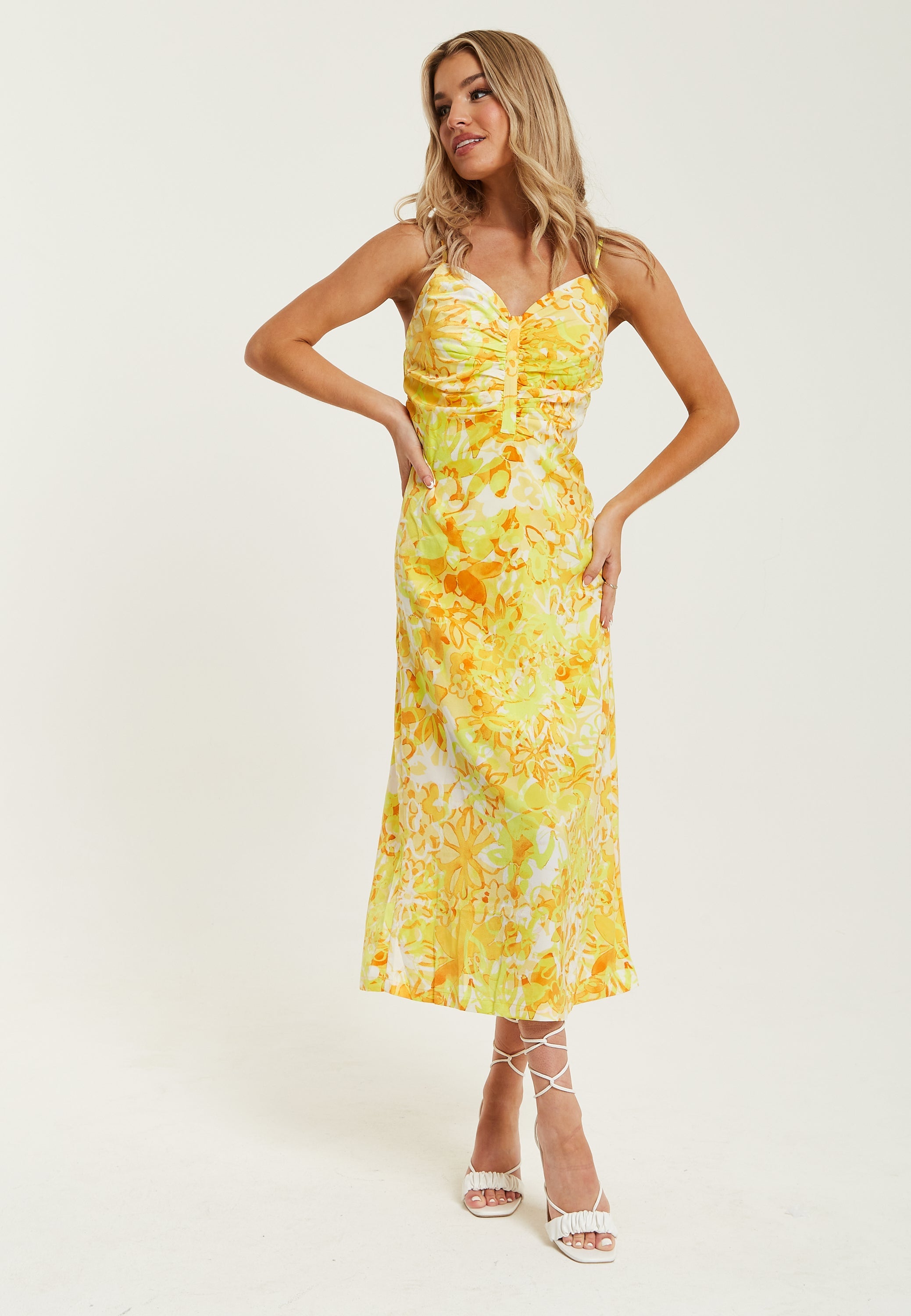 Women's Maxi Dress in Yellow and Orange Floral Print with Sleeveless Design and Ruching Detail - Liquorish
