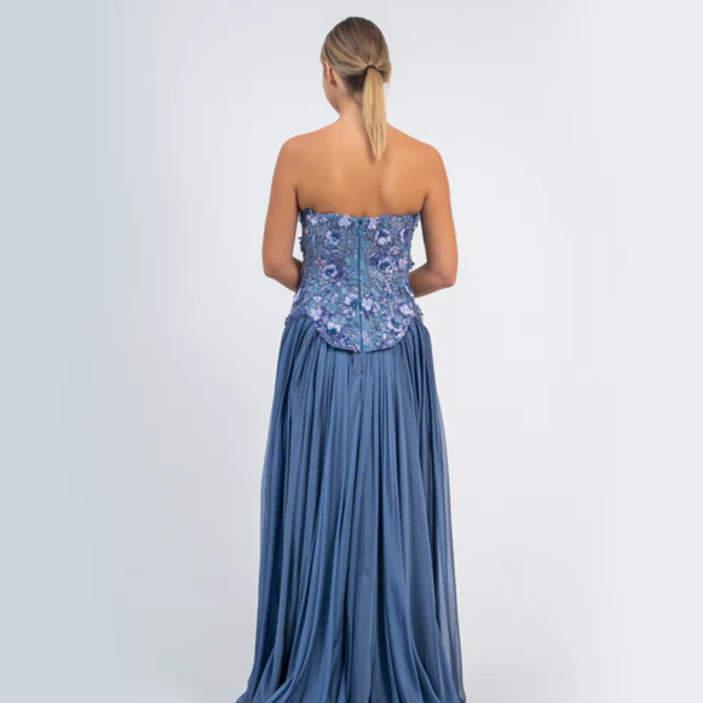 Shop online smoky blue gown with sculpted corset, floral embellishments and graceful flowing pleats, perfect for parties and special occasions.