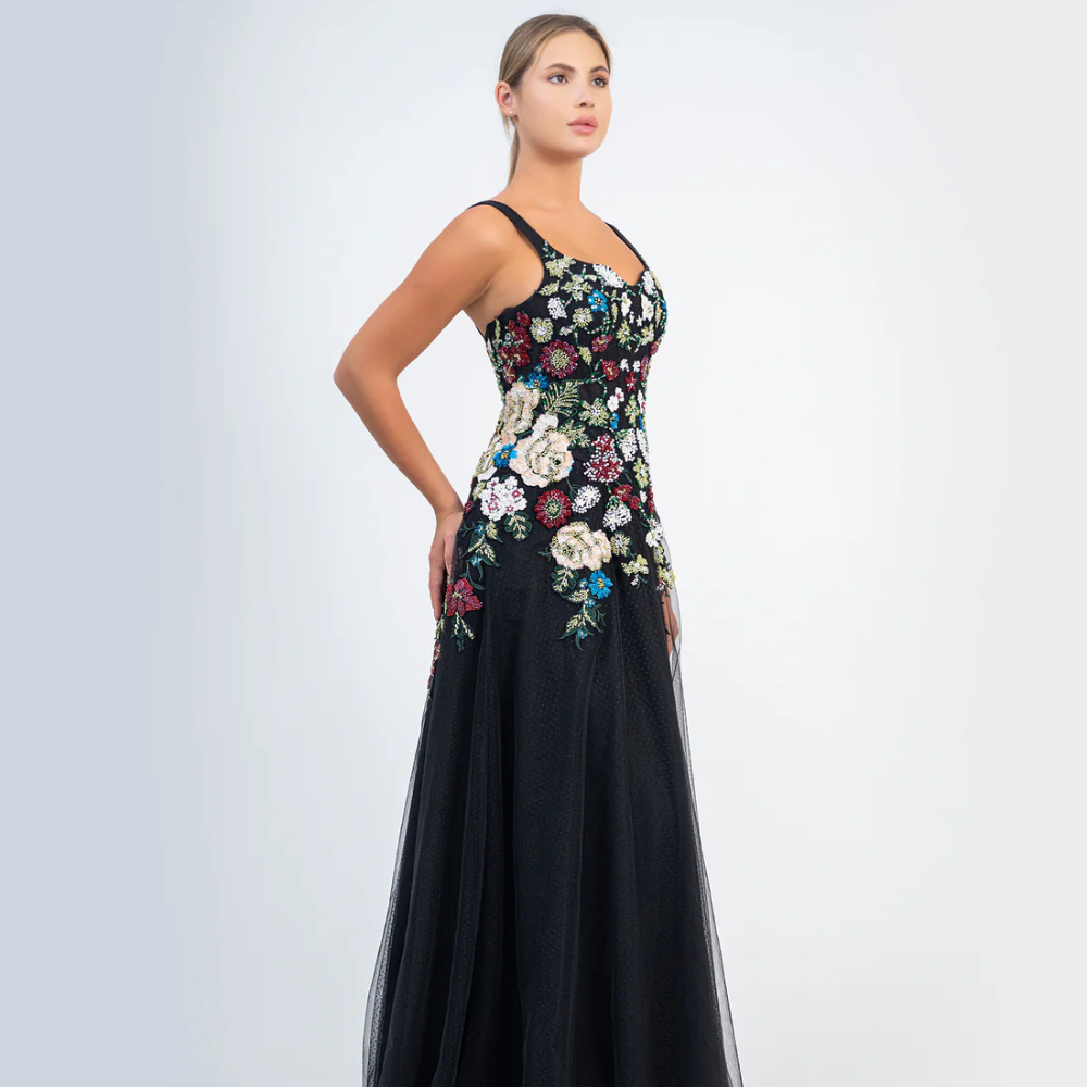 Shop online timeless black gown with blooming floral details and graceful flowing silhouette, perfect for parties, receptions and special occasions.