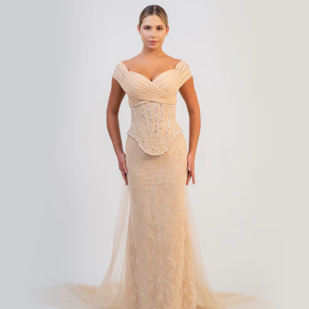 Shop online exquisite champagne mermaid gown with sculpted corset, delicate embellishments and timeless elegance, perfect for parties and special occasions.