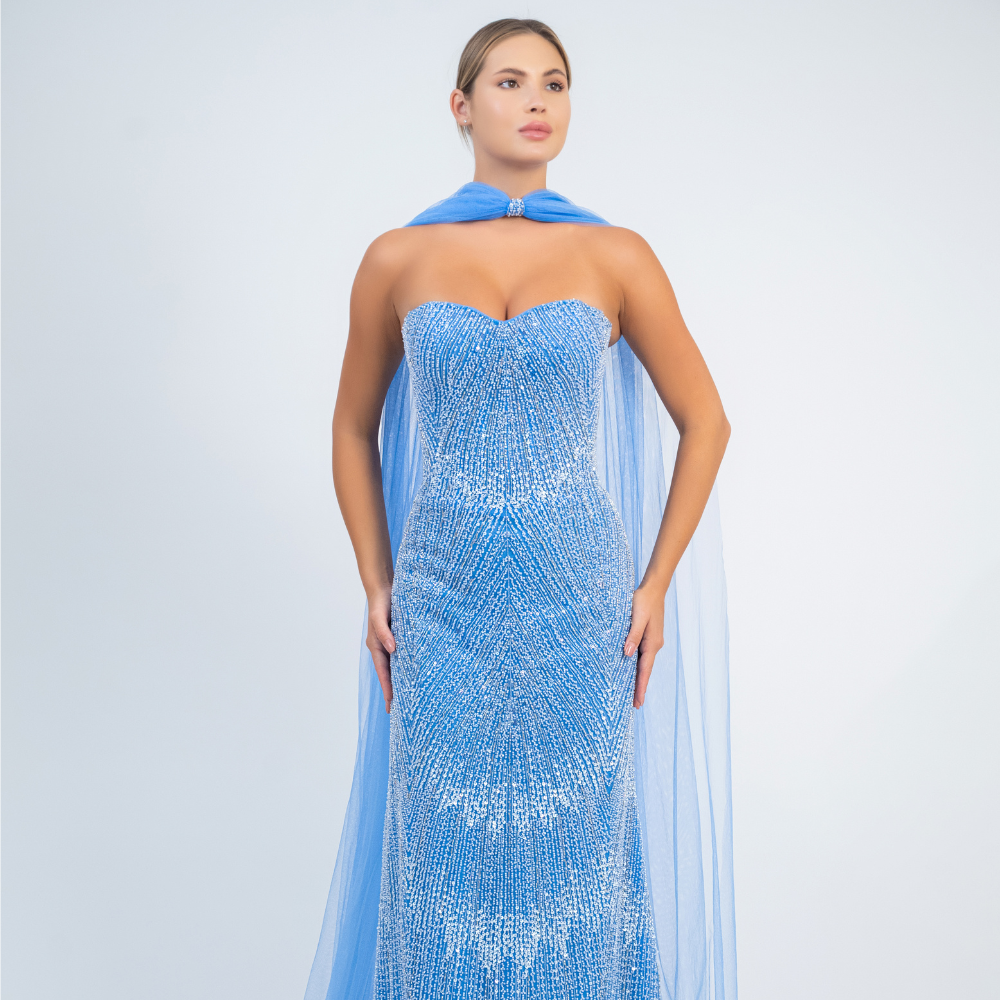 Shop online striking periwinkle gown with shimmering sequins and flowing tulle cape, perfect for parties, receptions and special occasions.