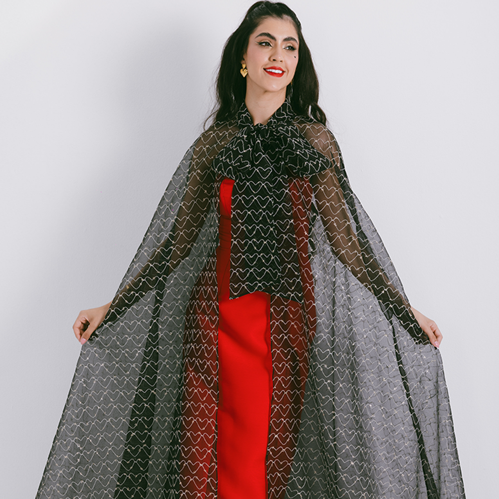 Organza cape with neck bow & heart shaped metallic threads on transparent fabric. Dress sold separately. Explore stylish capes for women. Shop now!
