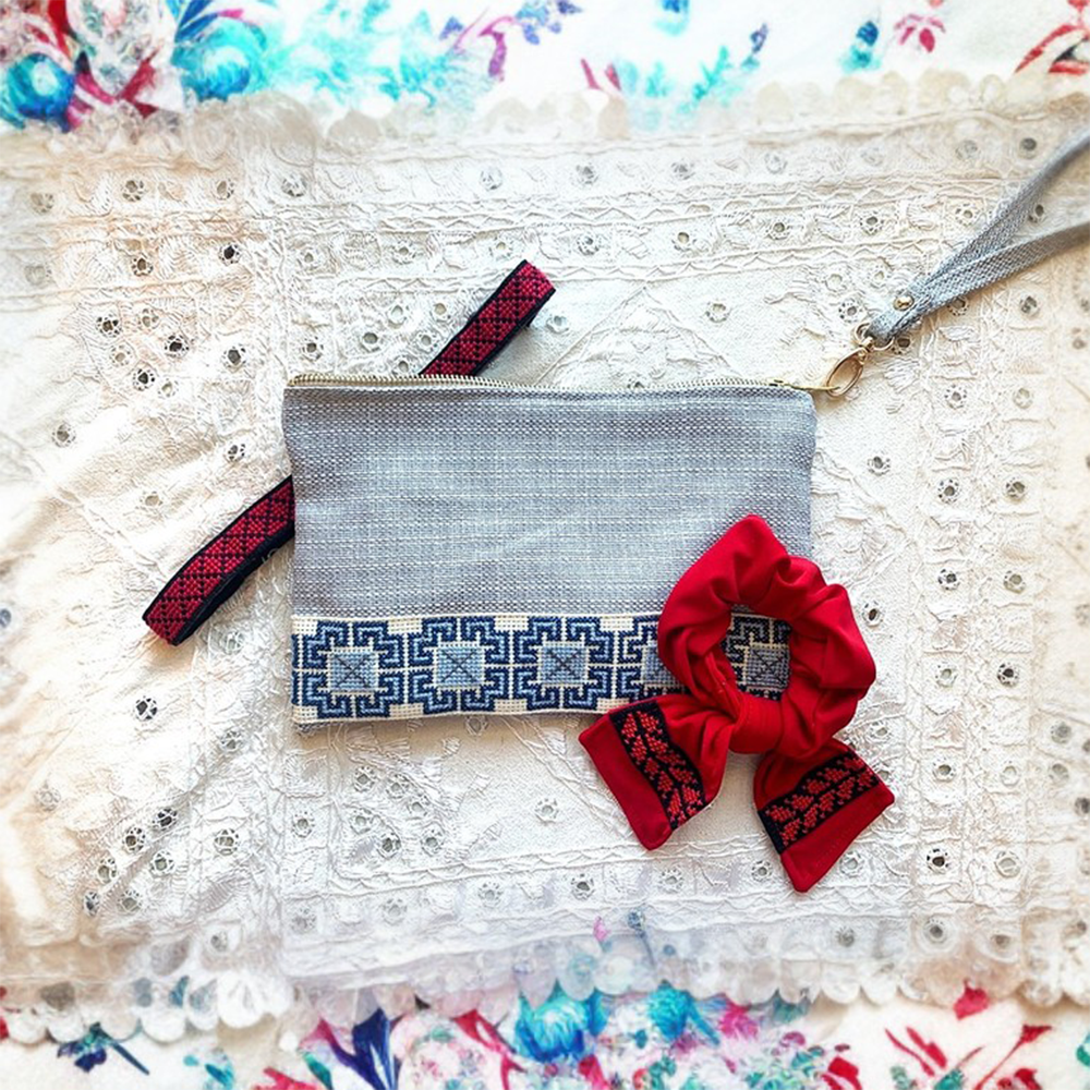 The Accessories Box features a your choice of Tatreez Headband, Key Fob, Scrunchie, and Tatreez Pouch in Blue.