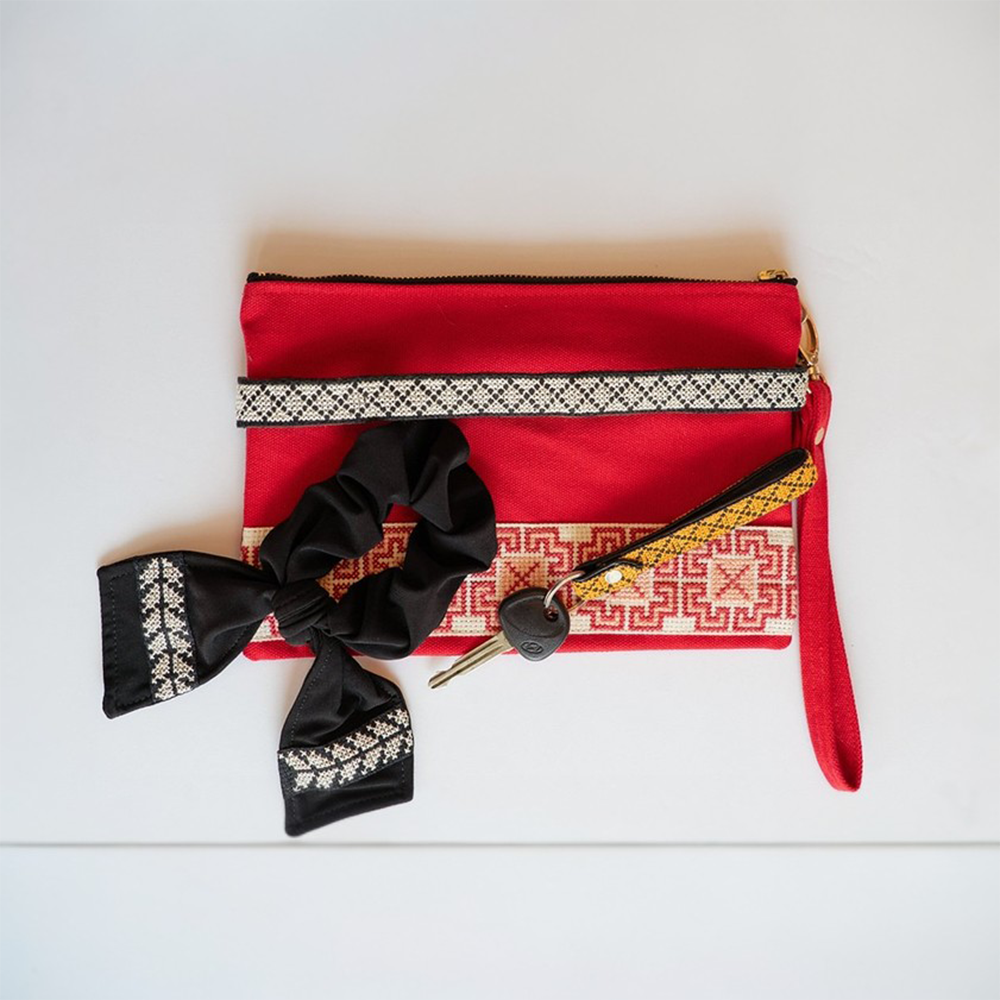 The Accessories Box features your choice of Tatreez Headband, Key Fob, Scrunchie, and Tatreez Pouch in Red.
