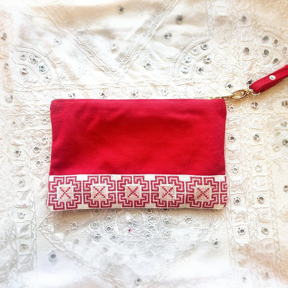 The Accessories Box features your choice of Tatreez Headband, Key Fob, Scrunchie, and Tatreez Pouch in Red.