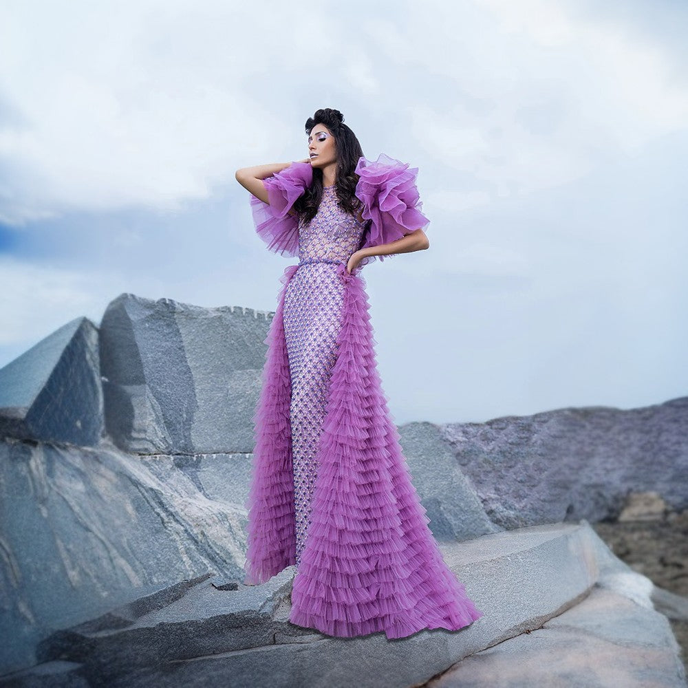 Swarovski Crystal studded lattice work design on top and front skirt and ruffled frill overskirt with train at the back.