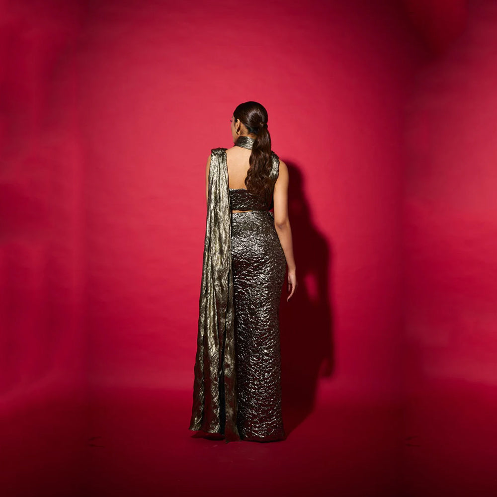Fusion saree gown with draped neckline and bustier skirt, perfect for events. Shop online from our curated edit of premium fashion.