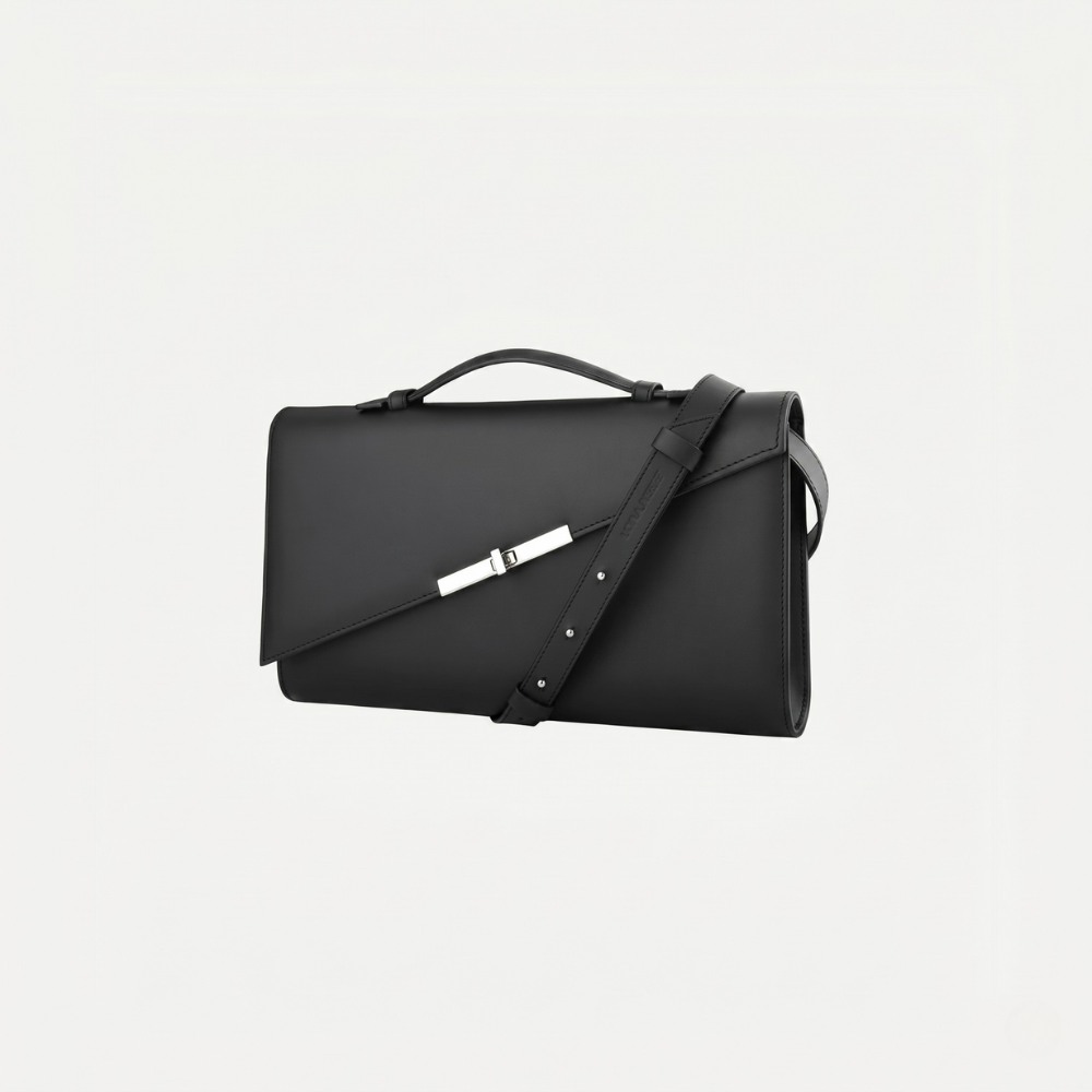 Italian leather clutch with strap and silver hardware, perfect for events. Shop online from our curated edit of premium fashion.