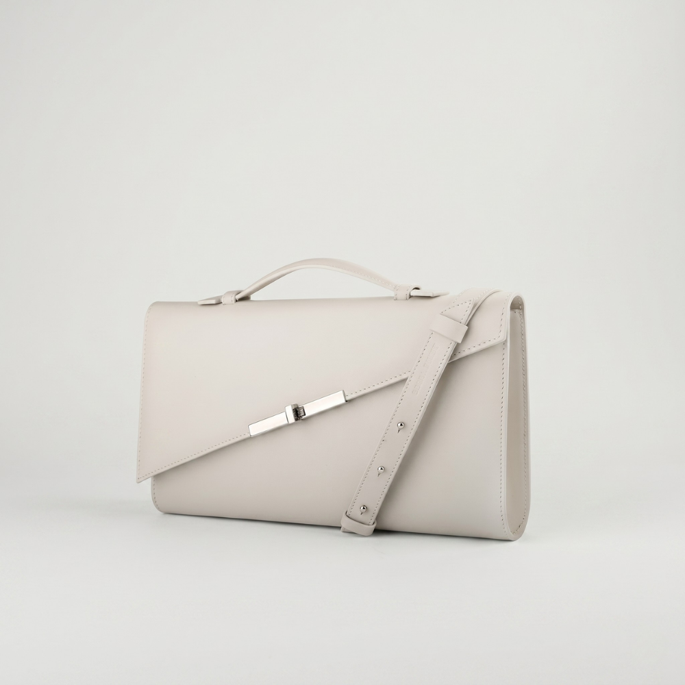 Italian leather clutch with detachable strap and silver hardware, pre order item. Shop online from our curated edit of premium fashion.