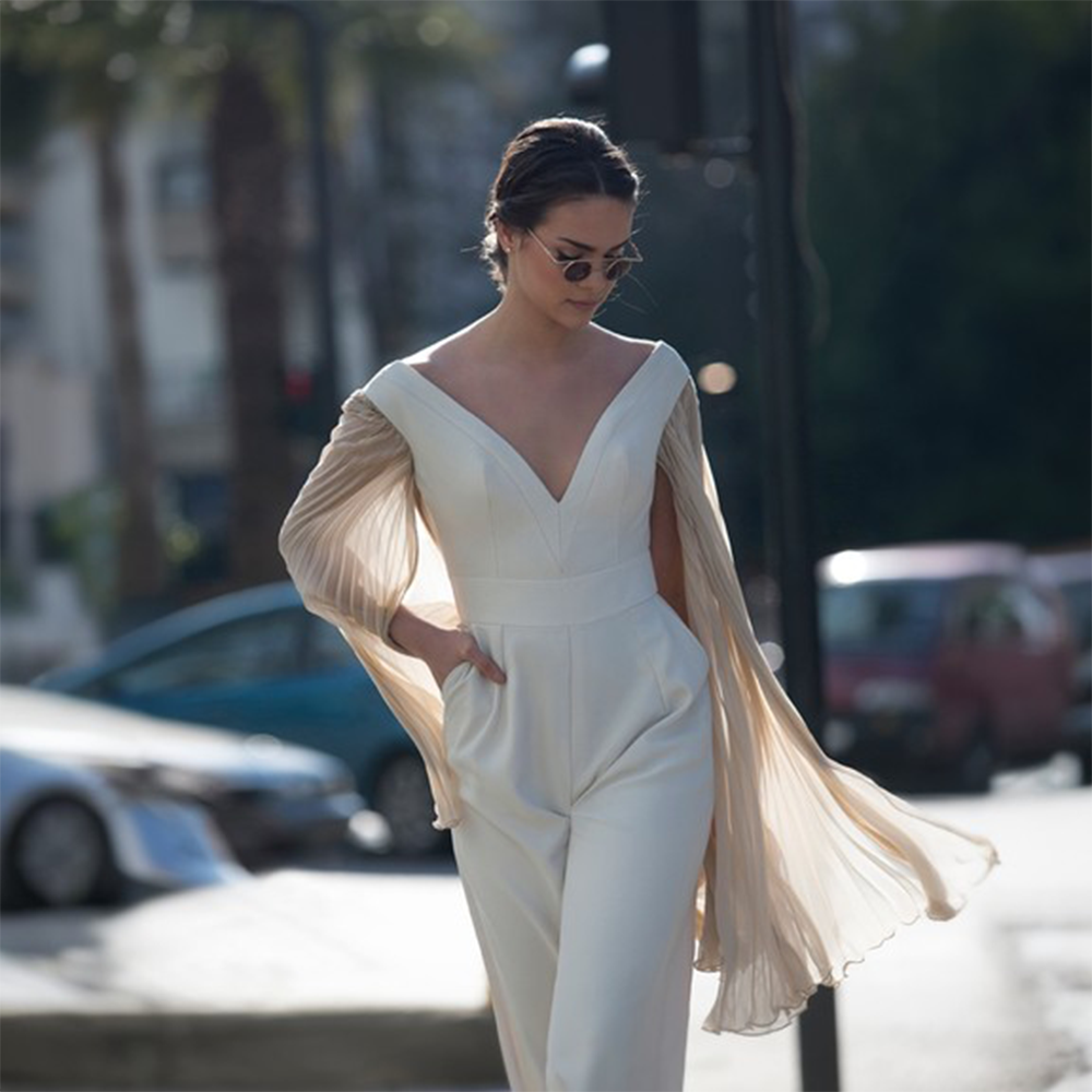 Beige overall with pleated silk mousseline sleeves. Perfect party wear women suit.