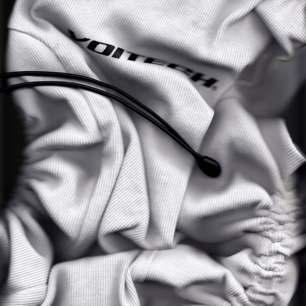 Shop online from our exclusive website and discover the Alpha Bungee Ribbed Vest by Voitech®, featuring ribbed stretch cotton, adjustable bungee detailing, and a bold technical streetwear design.