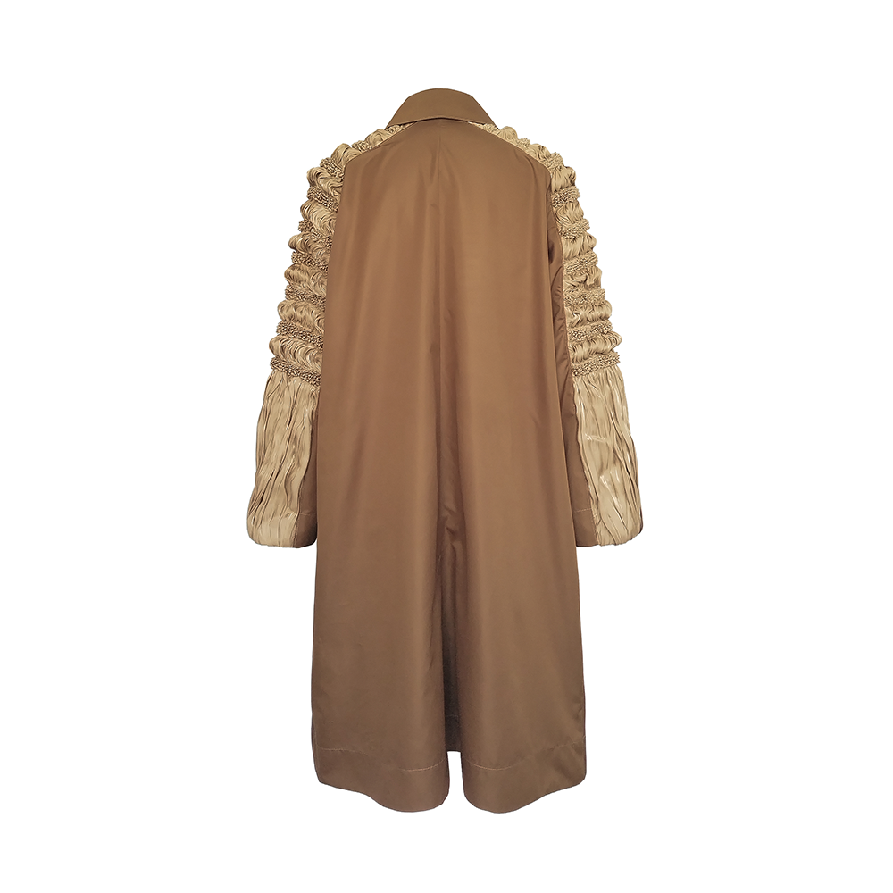 Shop Junna's Ana Shibori Panel Sleeve Pleated Front Coat. Elevate your style with this unique women's clothing piece. Shop now!
