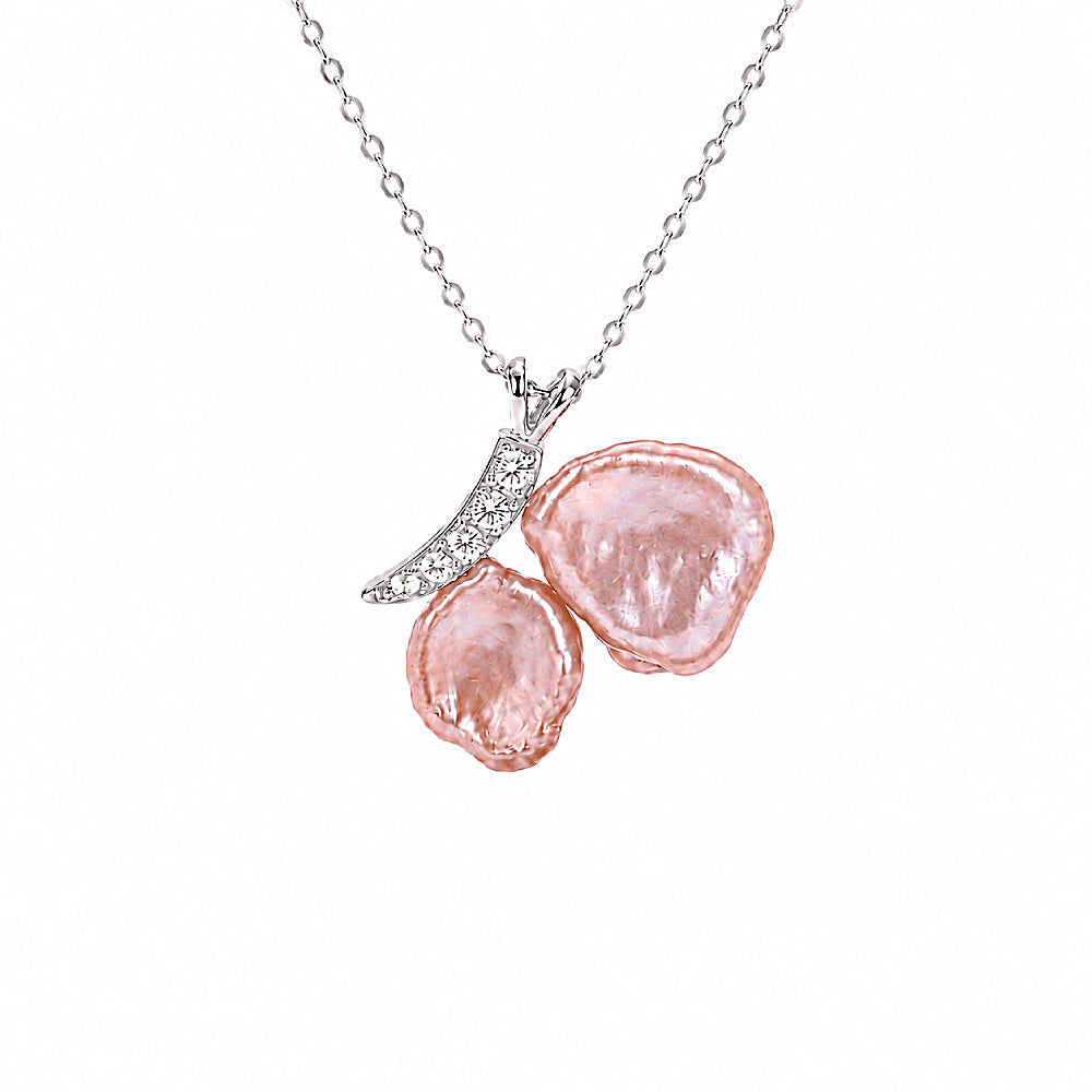 Discover the Aphrodite Blush Baroque Pearl & Silver Butterfly Necklace at The Luxe Maison, featuring luminous blush pearls and delicate silver accents.