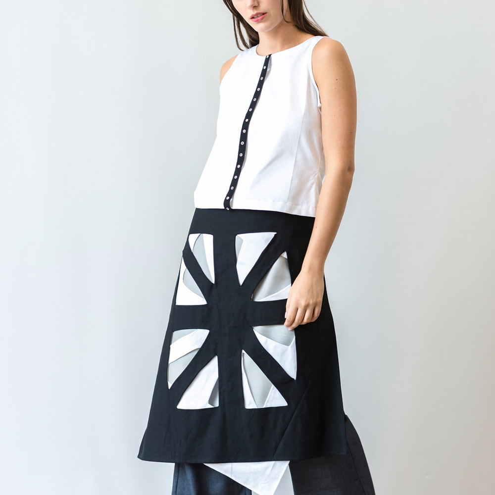 Hand crafted apron skirt inspired by the arabic art 'rub-el-hizb' represented as two overlapping square.