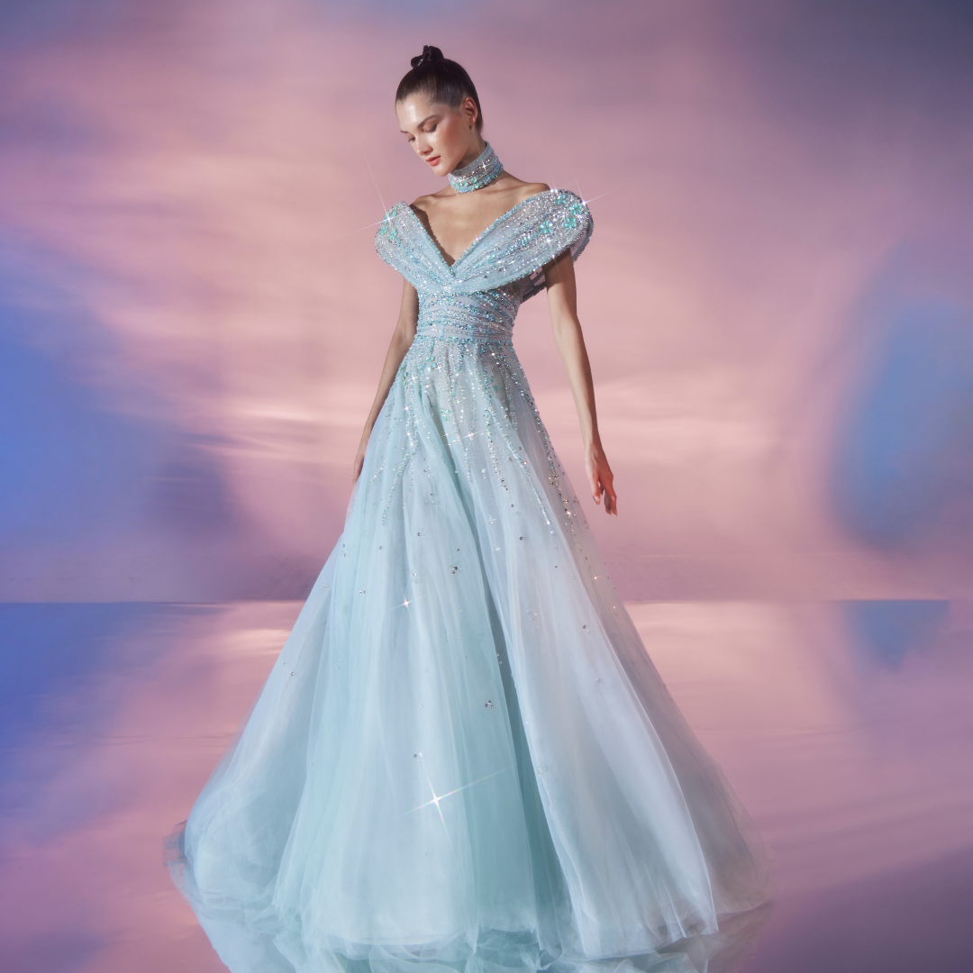 Princess cut Aqua tulle gown, embellished in stones, crystal, and beads.