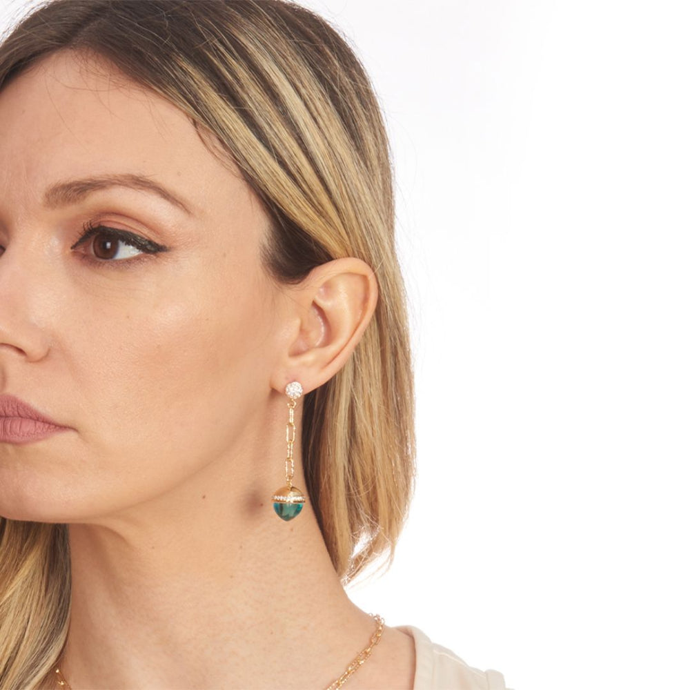 Shop online premium gold plated dangler earrings with aquamarine pyramidal crystal and cubic zirconia base with diamond cut detailing.