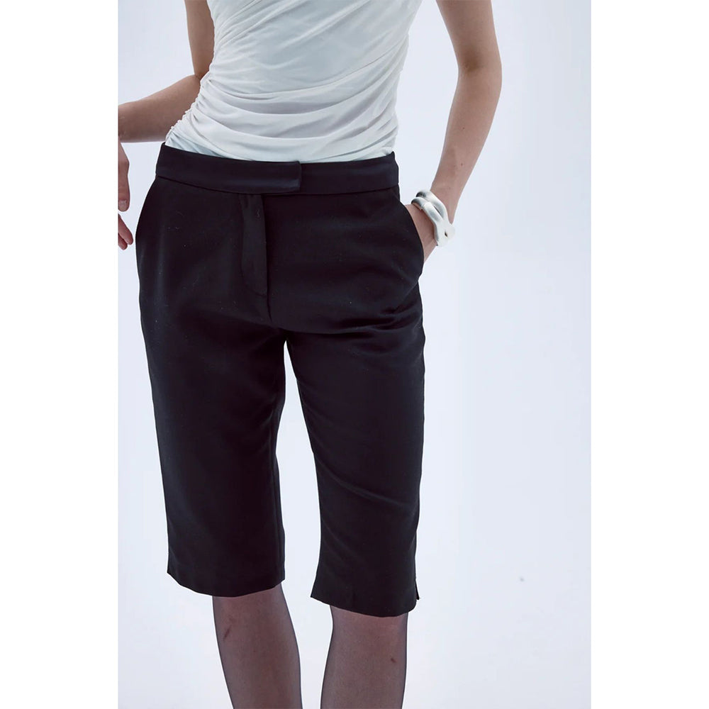 Explore the Arced Capri Trousers in our clothing shop for chic comfort. Shop Now!