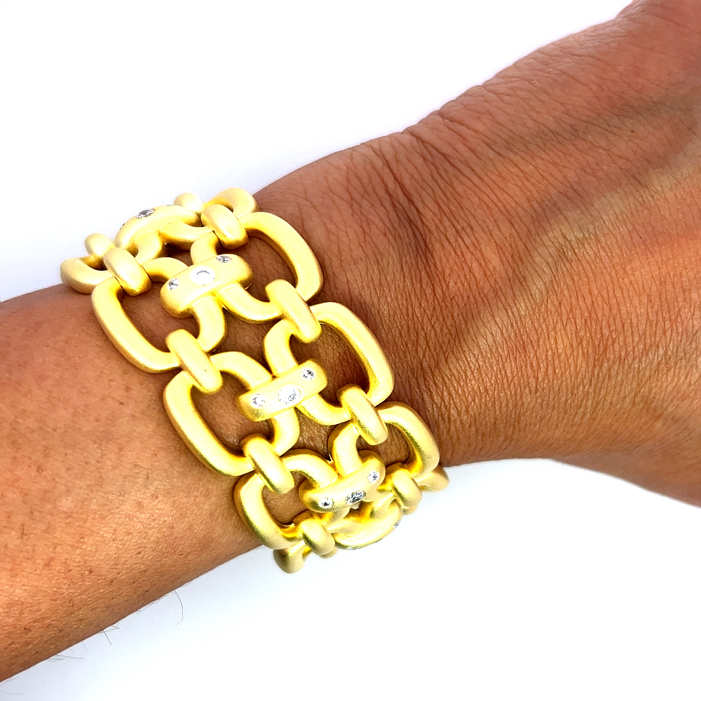 Sterling silver 18k gold-dipped link chain bracelet with sparkling cubic zirconia detailing for a bold statement finish. Shop premium jewelry online.