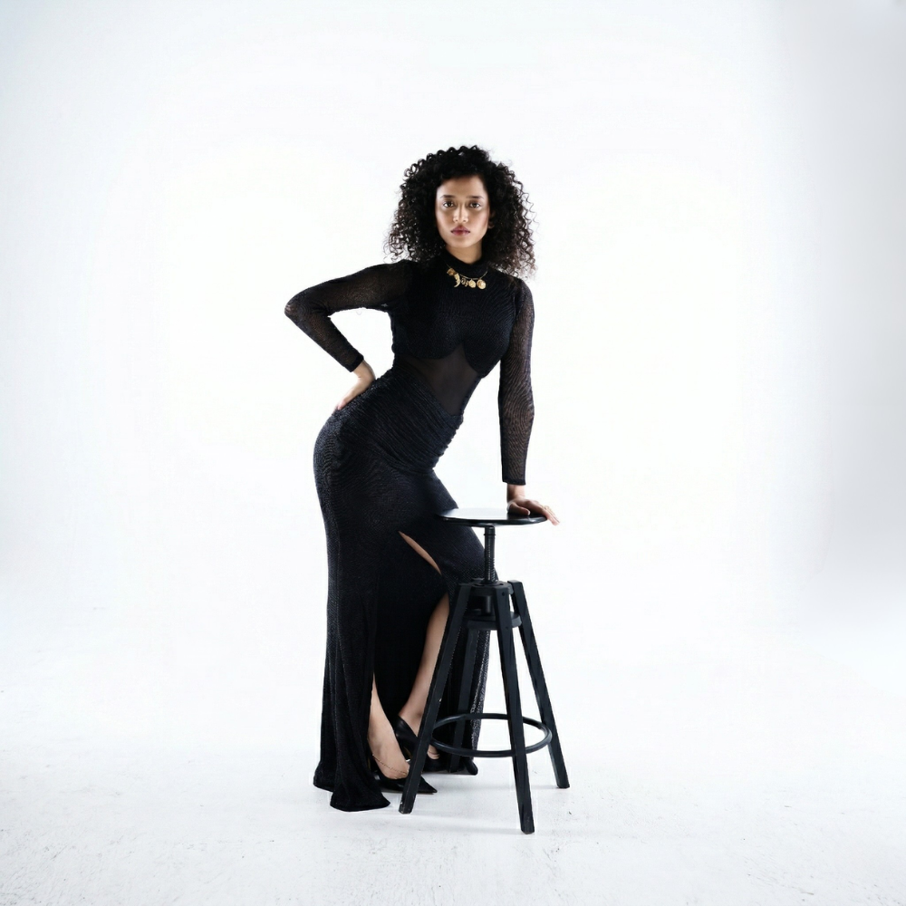 Black shimmer bustier dress with gathered skirt and slit, perfect for brunch and vacations. Shop online from our exclusive collection of premium styles.