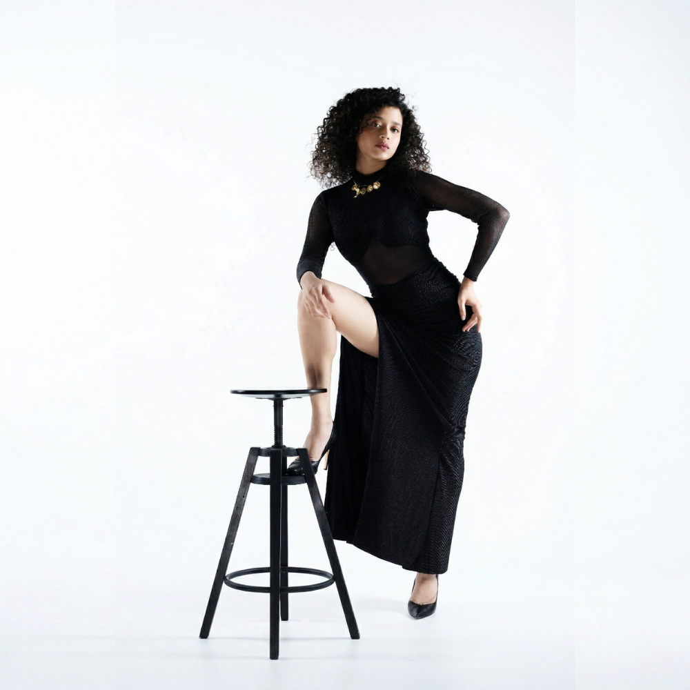 Black shimmer bustier dress with gathered skirt and slit, perfect for brunch and vacations. Shop online from our exclusive collection of premium styles.