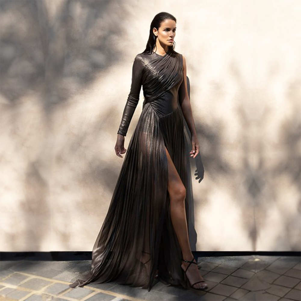 Foiled tulle asymmetric draped dress with falling cape.