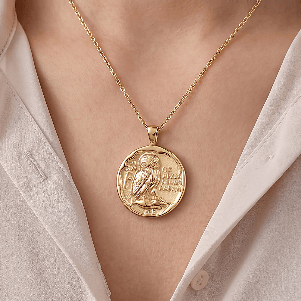 Discover the Athena's Owl Gold Vermeil Coin Necklace at The Luxe Maison, featuring an ancient Greek-inspired coin pendant with Athena's sacred owl, symbolizing wisdom, knowledge, and inner strength.