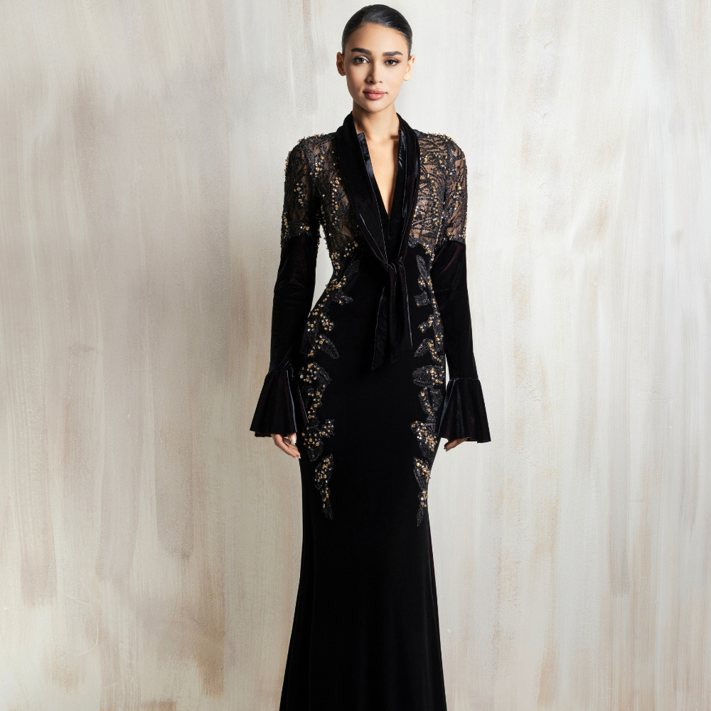 Black long-sleeve gown with a lace bodice and deep neckline, designed for timeless elegance. Shop now at our exclusive clothing website.