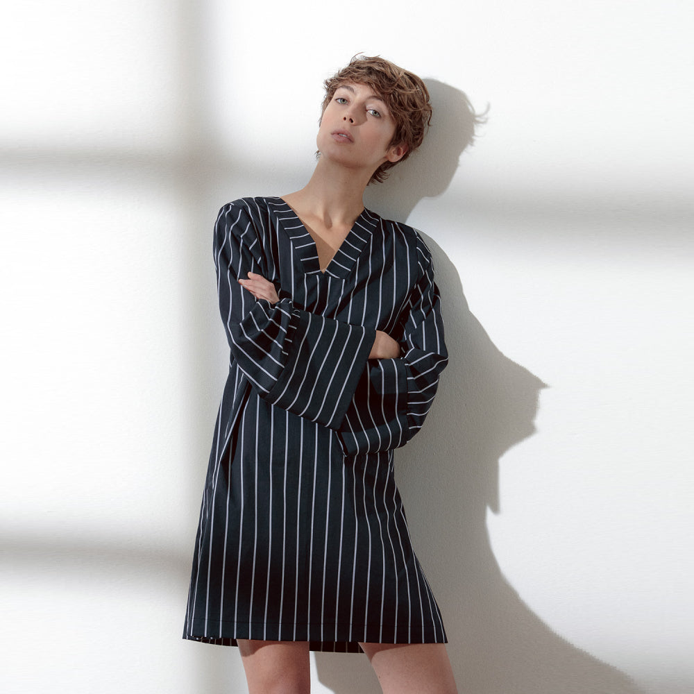 Discover the Aya Shirt at The Luxe Maison, featuring wide kimono-style sleeves, a V-neckline, and side slits for effortless, versatile styling.